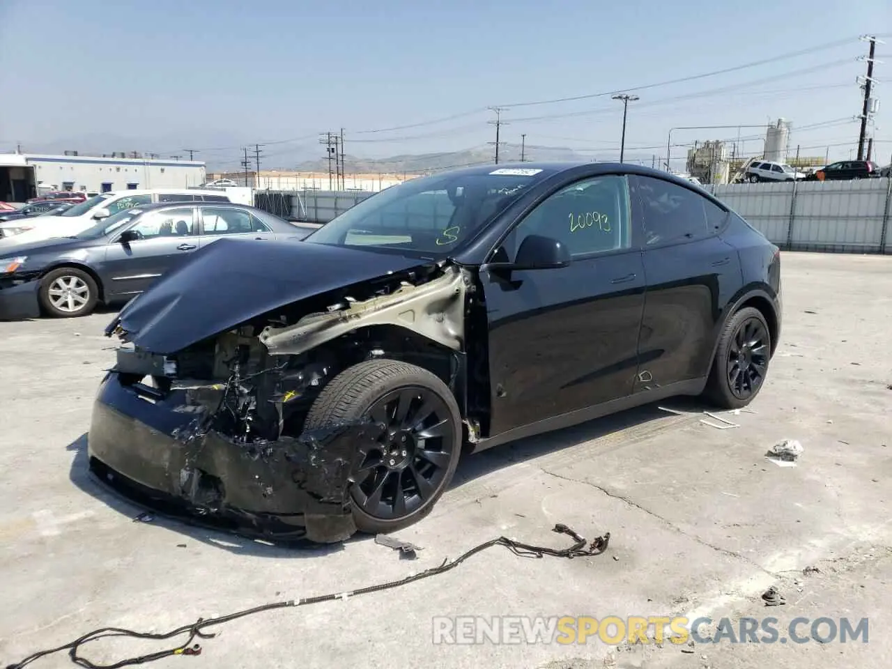 2 fotografías del automóvil dañado 5YJYGDED4MF124166 TESLA MODEL Y 2021