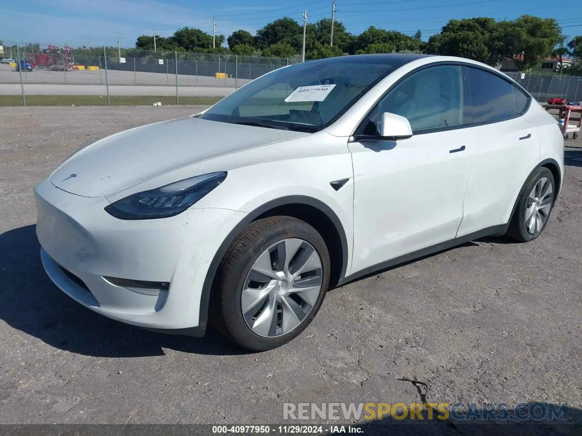 2 fotografías del automóvil dañado 5YJYGDED5MF115203 TESLA MODEL Y 2021