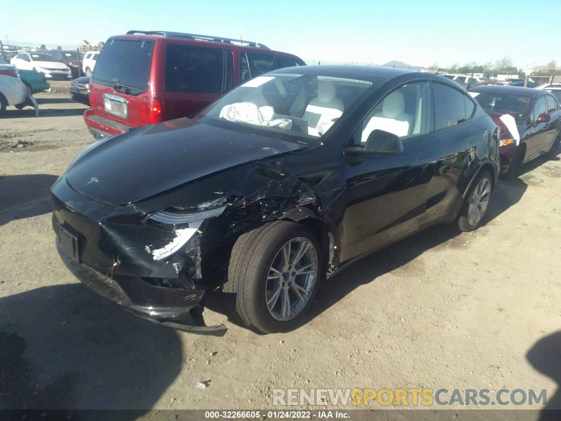 2 fotografías del automóvil dañado 5YJYGDED9MF103961 TESLA MODEL Y 2021