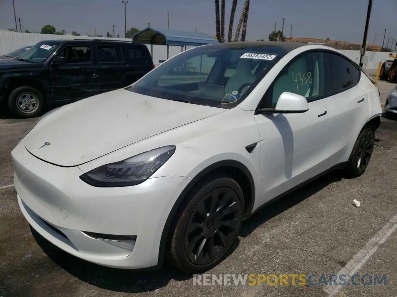 2 fotografías del automóvil dañado 5YJYGDEE0MF269133 TESLA MODEL Y 2021