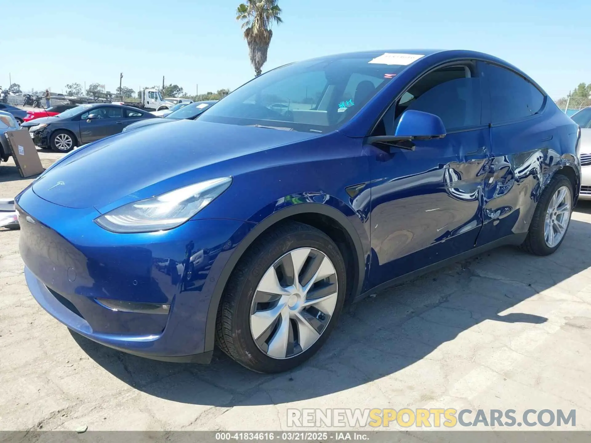 2 fotografías del automóvil dañado 5YJYGDEE0MF270461 TESLA MODEL Y 2021