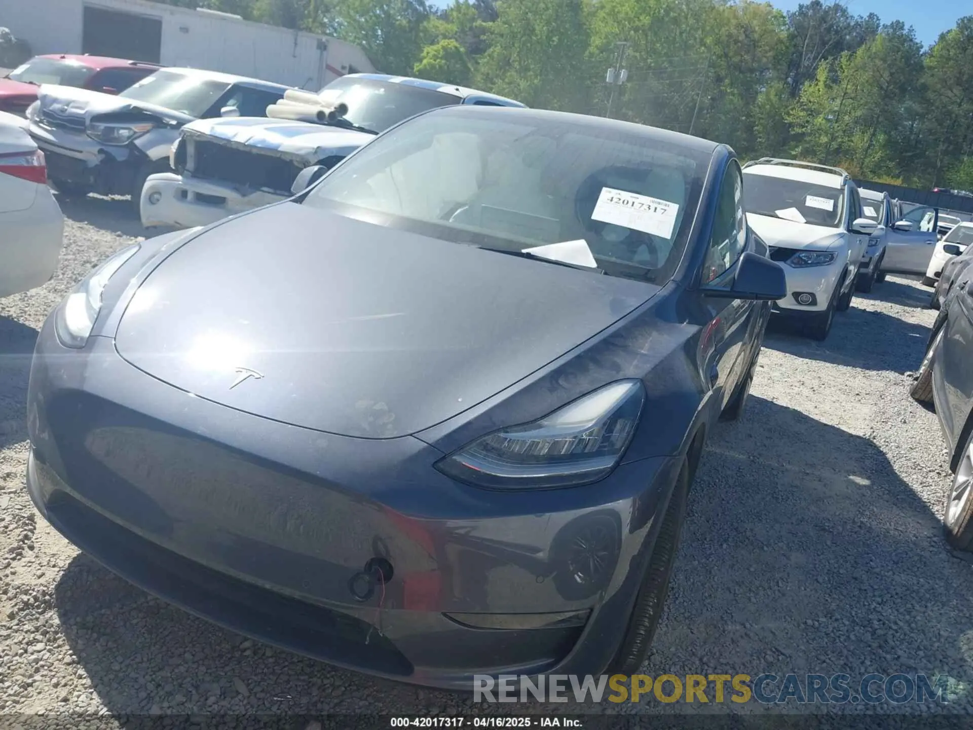 2 fotografías del automóvil dañado 5YJYGDEE0MF295134 TESLA MODEL Y 2021