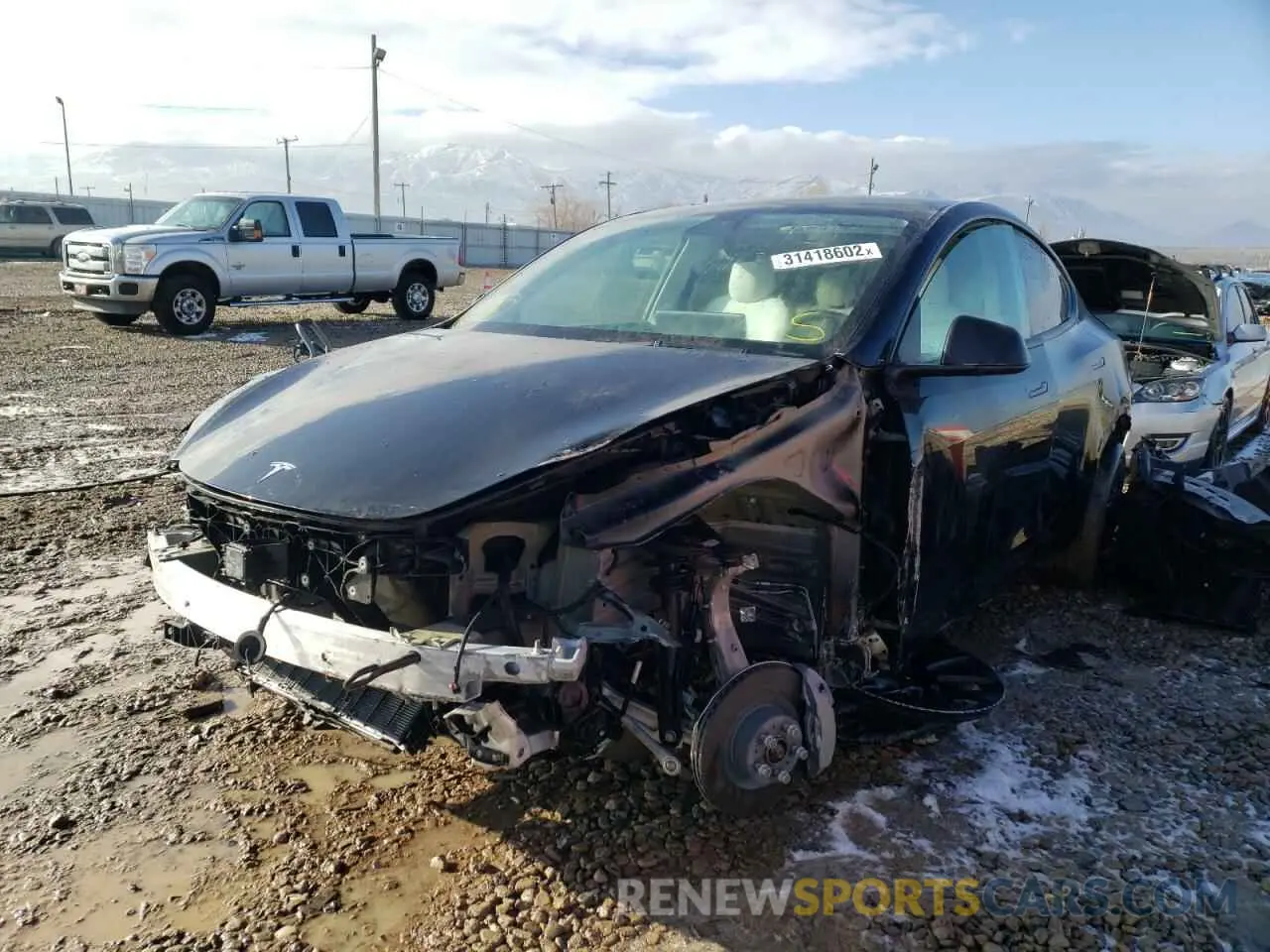 2 fotografías del automóvil dañado 5YJYGDEE1MF088638 TESLA MODEL Y 2021