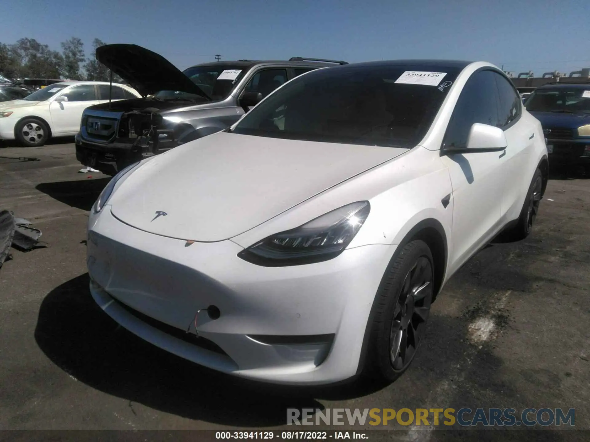2 fotografías del automóvil dañado 5YJYGDEE2MF061352 TESLA MODEL Y 2021