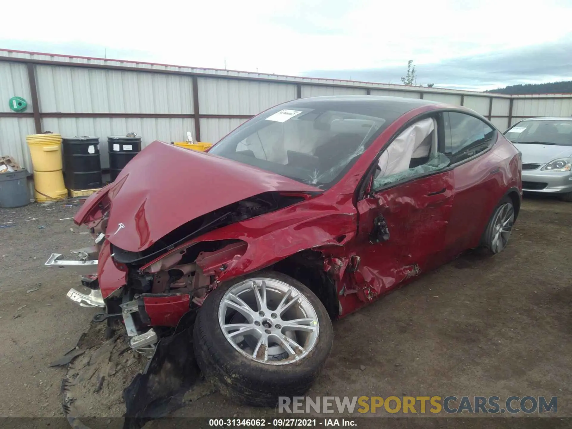 2 fotografías del automóvil dañado 5YJYGDEE2MF124837 TESLA MODEL Y 2021