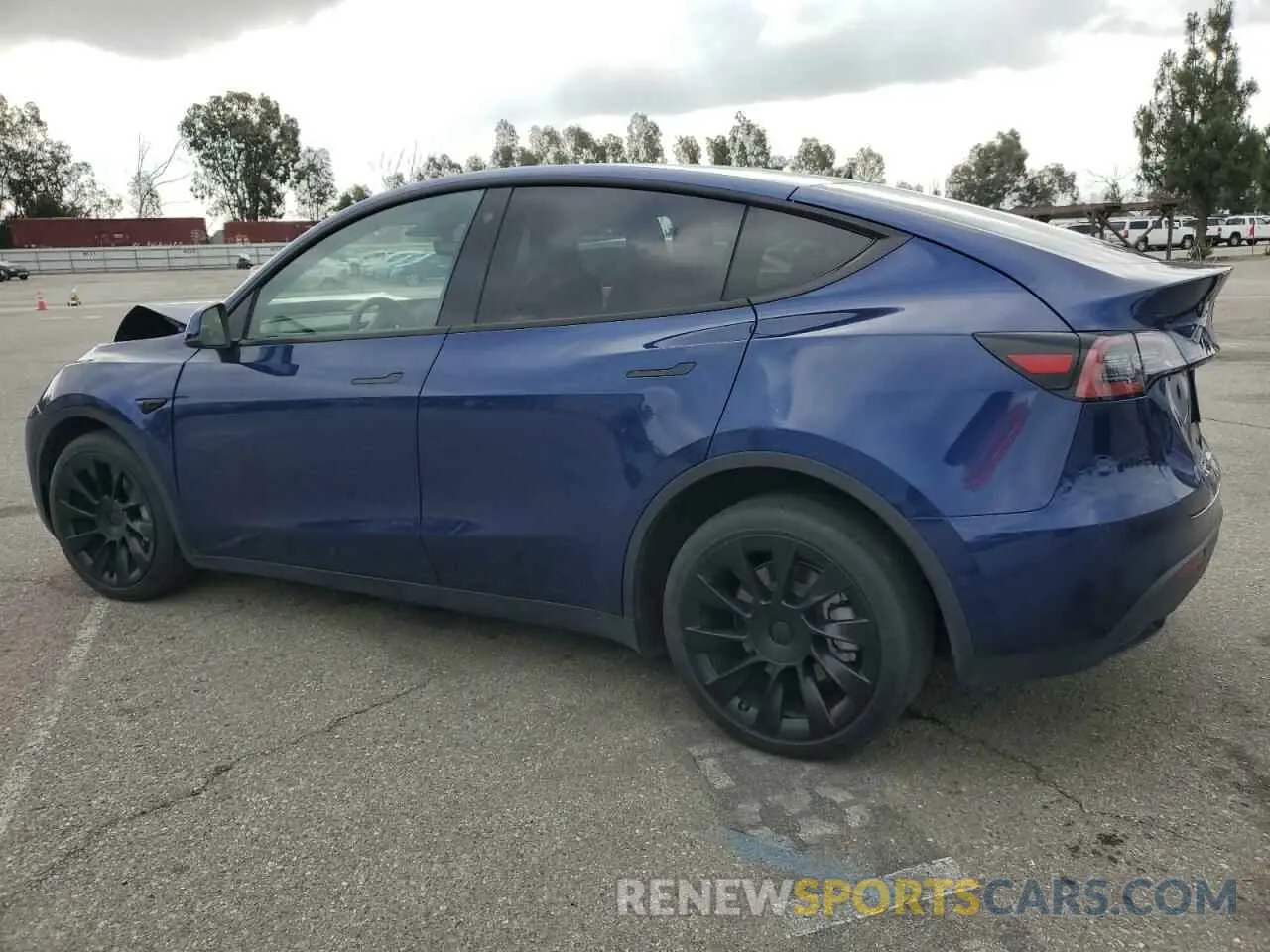2 fotografías del automóvil dañado 5YJYGDEE2MF207913 TESLA MODEL Y 2021