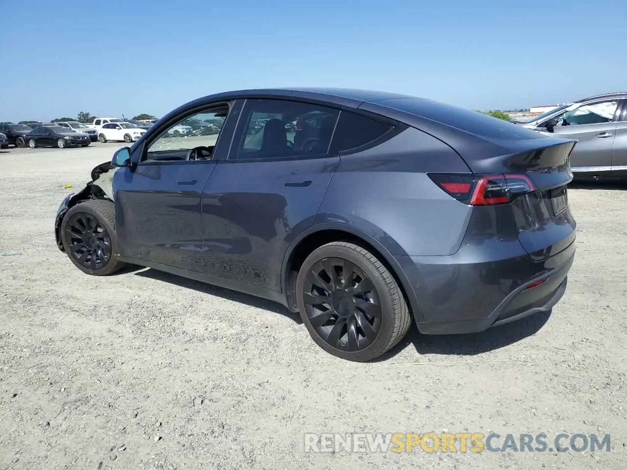 2 fotografías del automóvil dañado 5YJYGDEE2MF296446 TESLA MODEL Y 2021