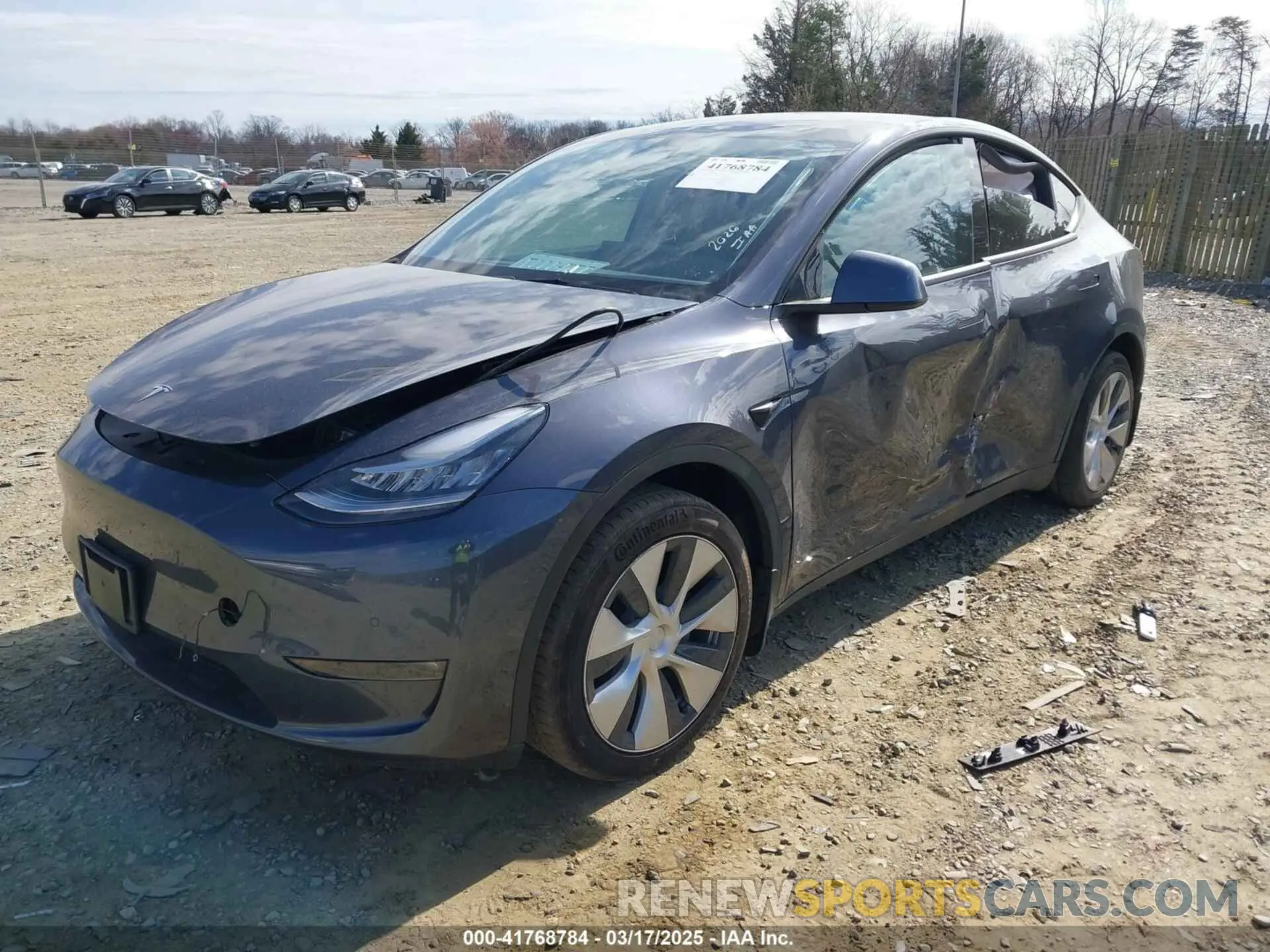 2 fotografías del automóvil dañado 5YJYGDEE2MF300009 TESLA MODEL Y 2021