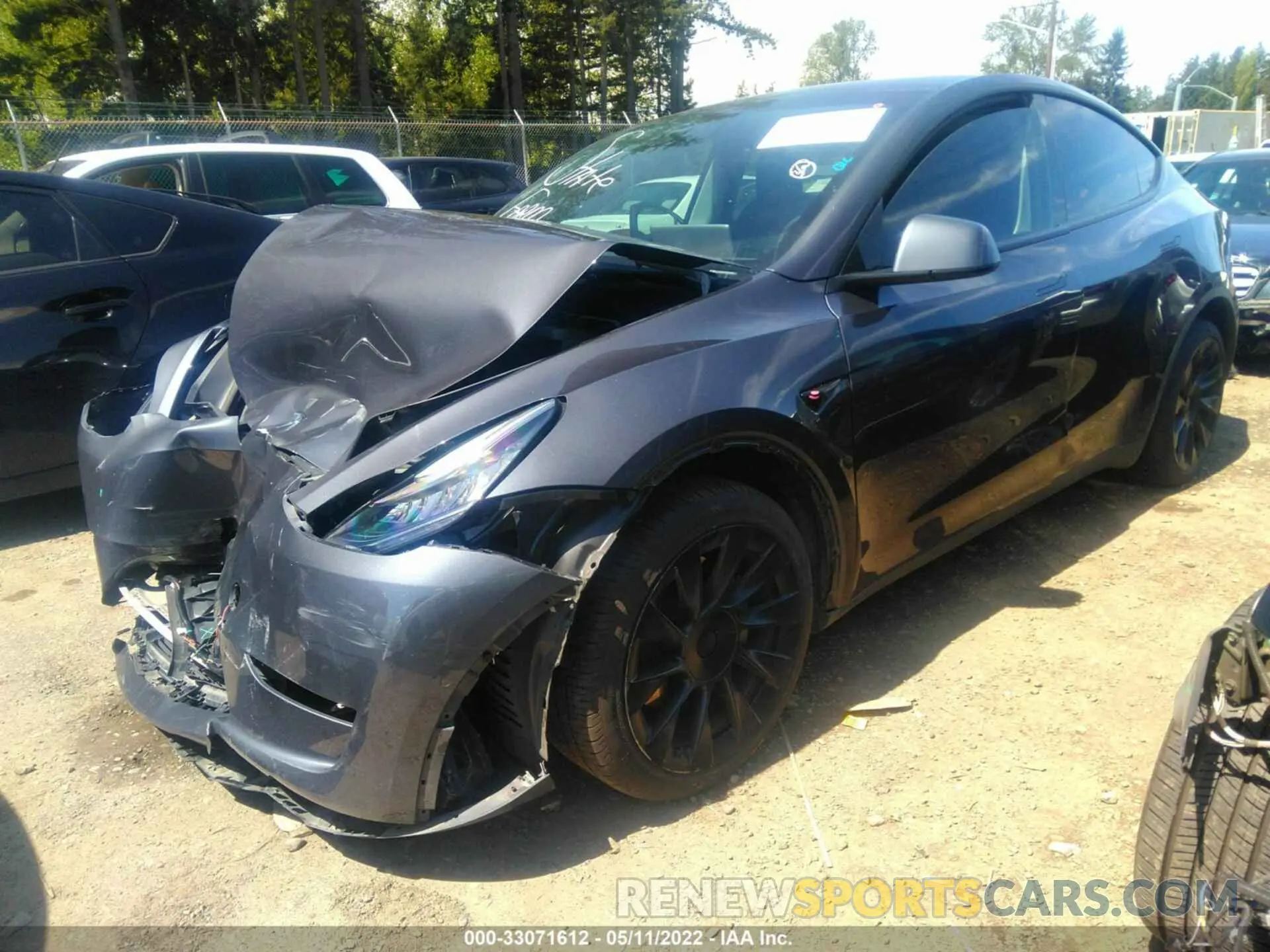 2 fotografías del automóvil dañado 5YJYGDEE3MF073817 TESLA MODEL Y 2021