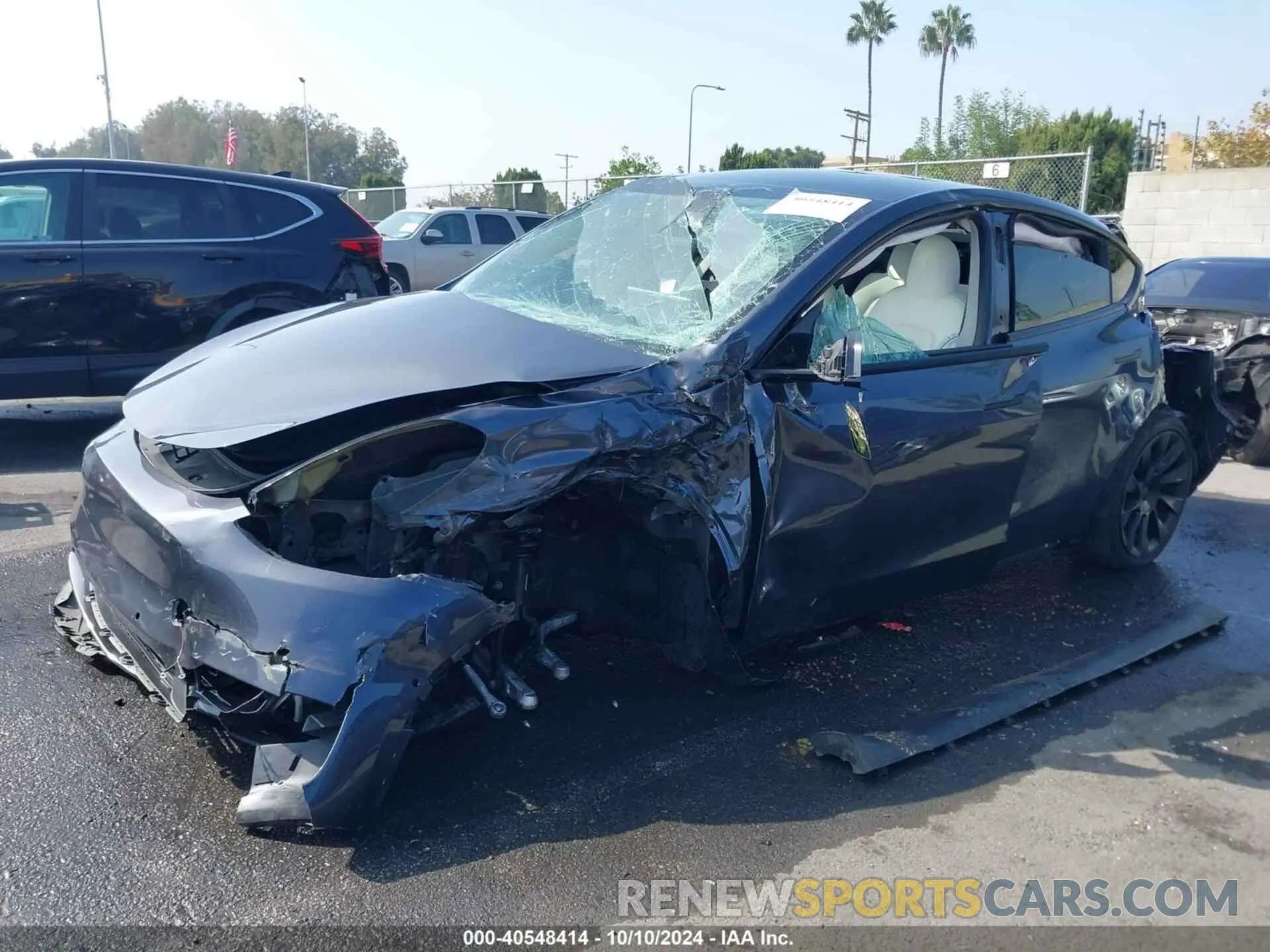 2 fotografías del automóvil dañado 5YJYGDEE3MF098040 TESLA MODEL Y 2021