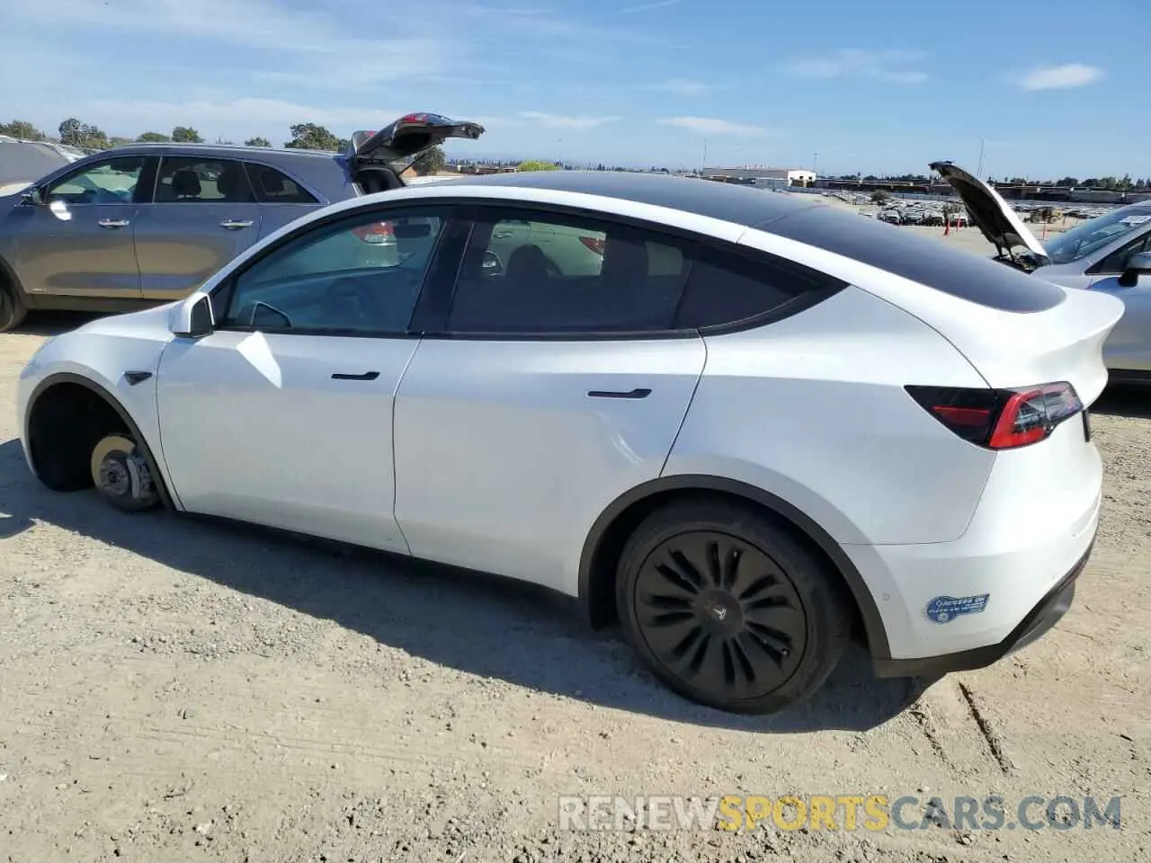 2 fotografías del automóvil dañado 5YJYGDEE4MF114374 TESLA MODEL Y 2021