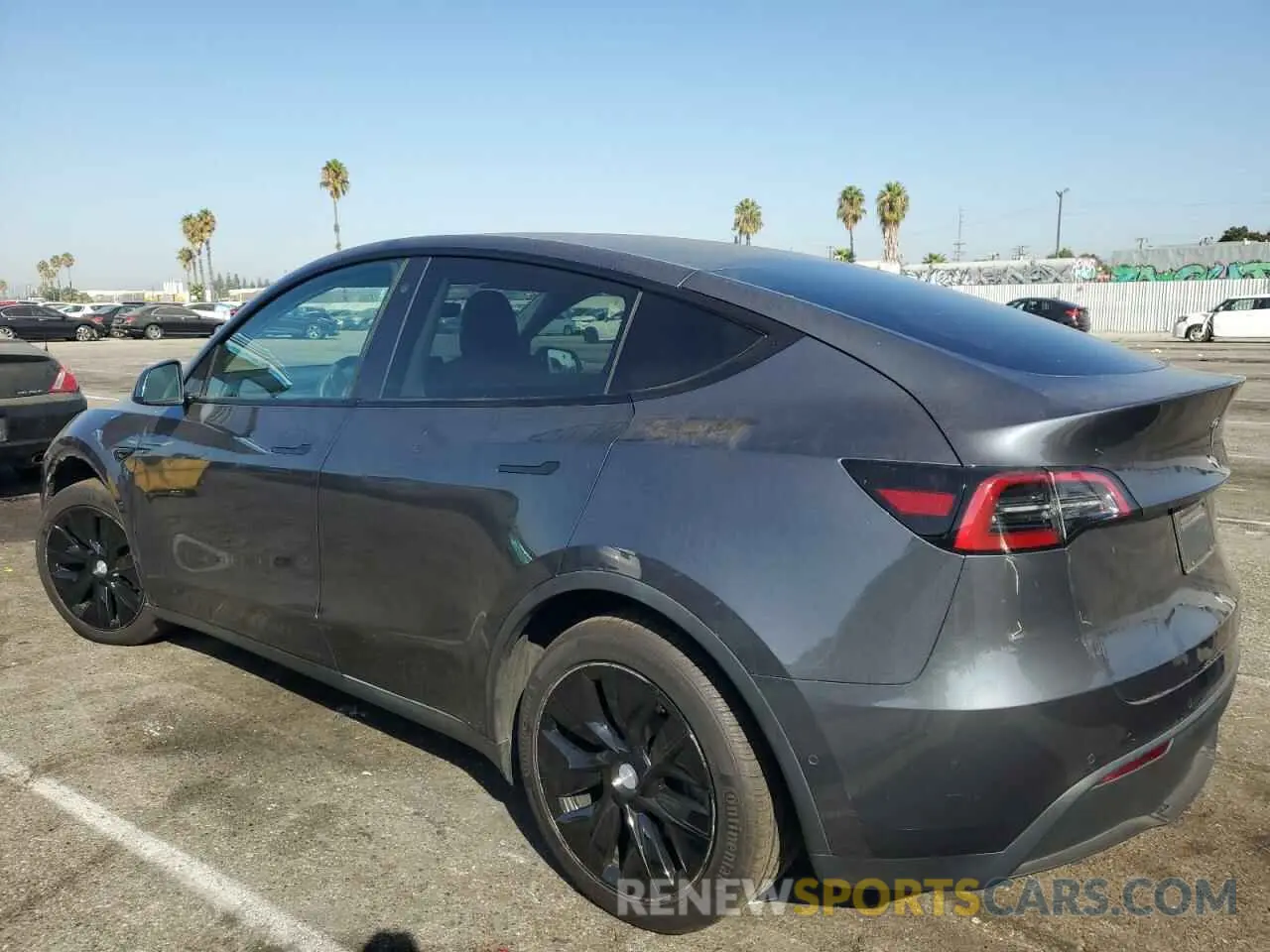 2 fotografías del automóvil dañado 5YJYGDEE4MF161131 TESLA MODEL Y 2021