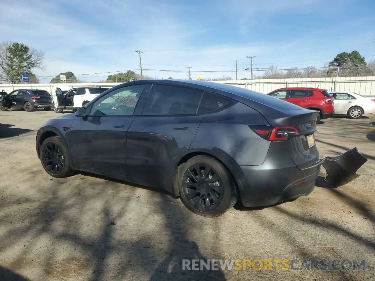 2 fotografías del automóvil dañado 5YJYGDEE4MF208593 TESLA MODEL Y 2021