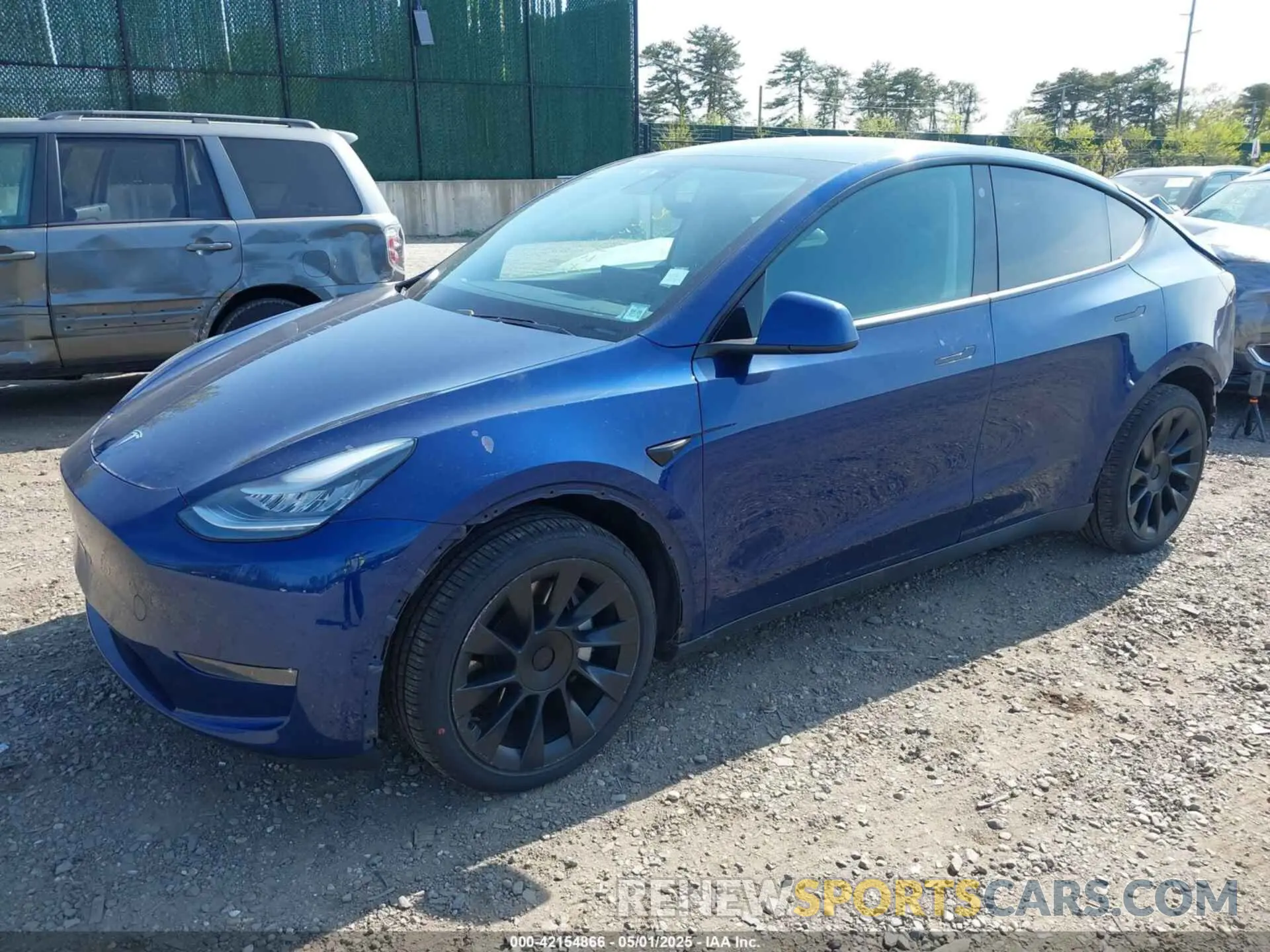 2 fotografías del automóvil dañado 5YJYGDEE5MF089548 TESLA MODEL Y 2021
