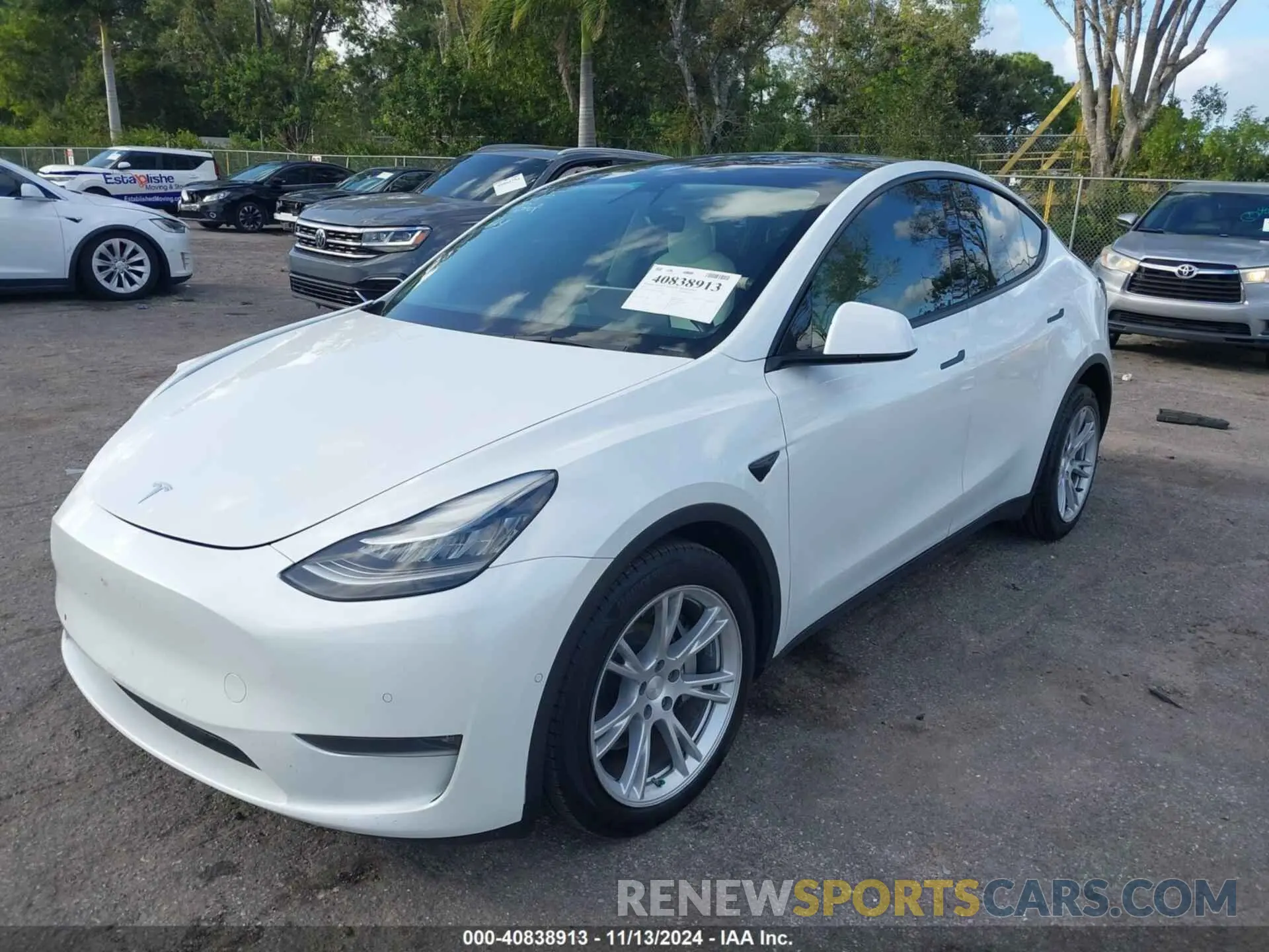 2 fotografías del automóvil dañado 5YJYGDEE6MF102873 TESLA MODEL Y 2021