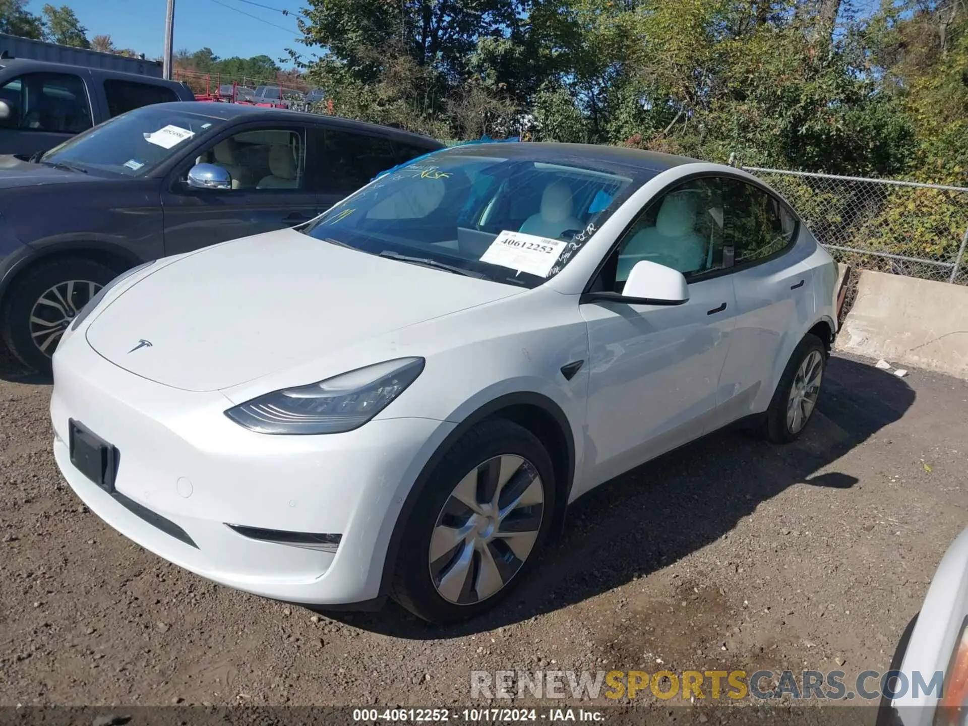 2 fotografías del automóvil dañado 5YJYGDEE6MF118121 TESLA MODEL Y 2021