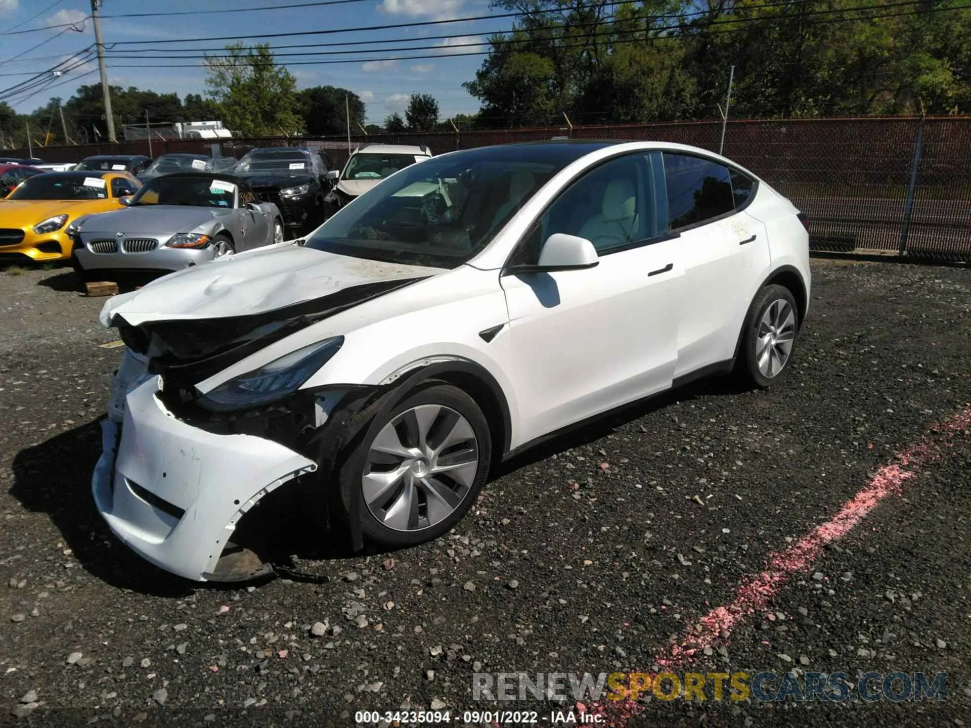 2 fotografías del automóvil dañado 5YJYGDEE6MF283831 TESLA MODEL Y 2021