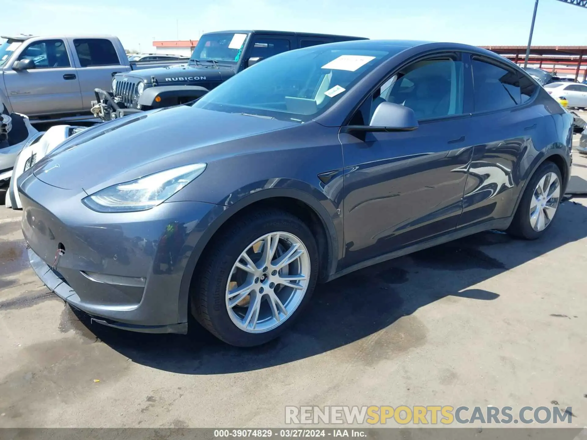 2 fotografías del automóvil dañado 5YJYGDEE7MF086599 TESLA MODEL Y 2021
