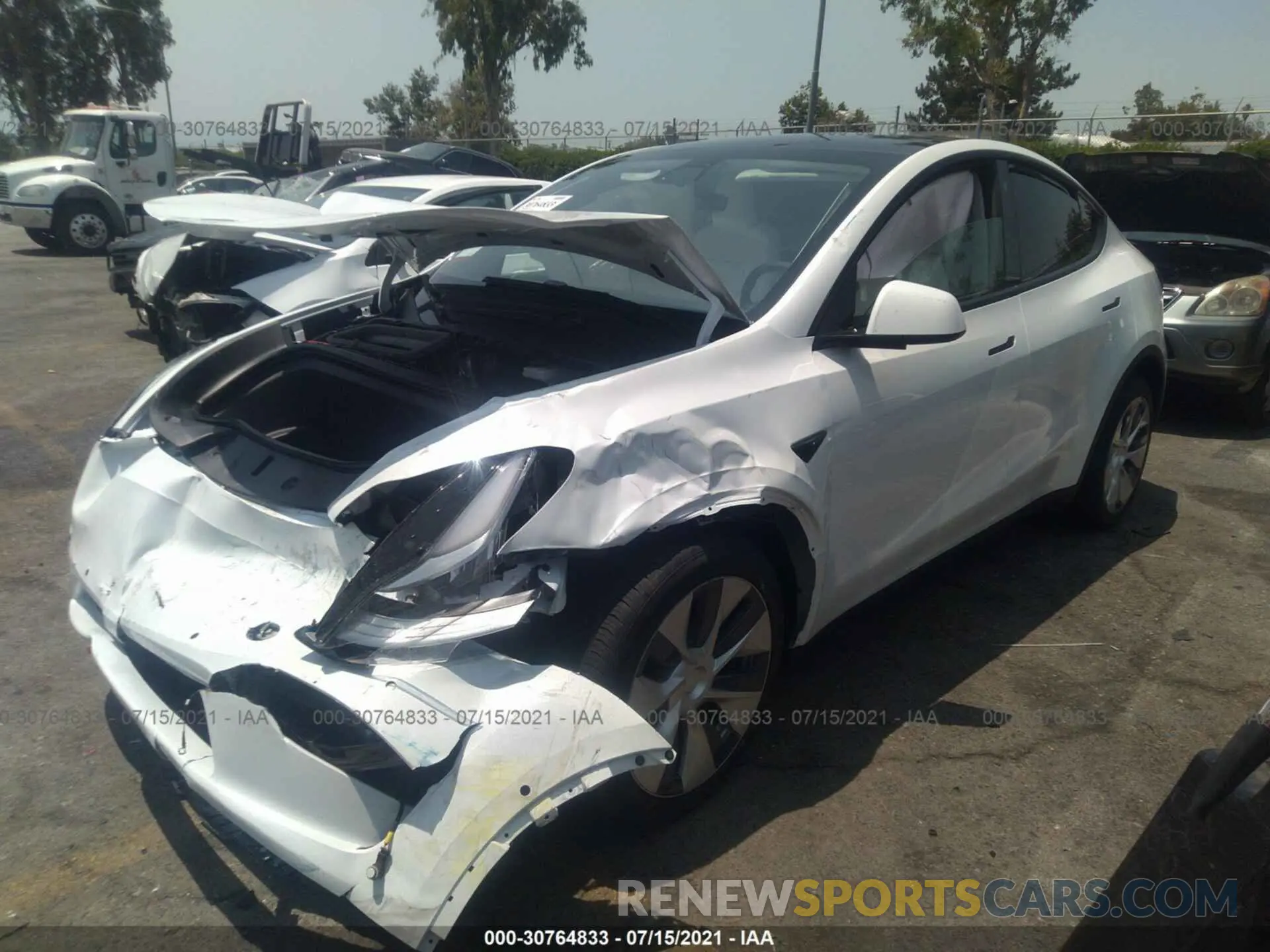 2 fotografías del automóvil dañado 5YJYGDEE7MF206028 TESLA MODEL Y 2021