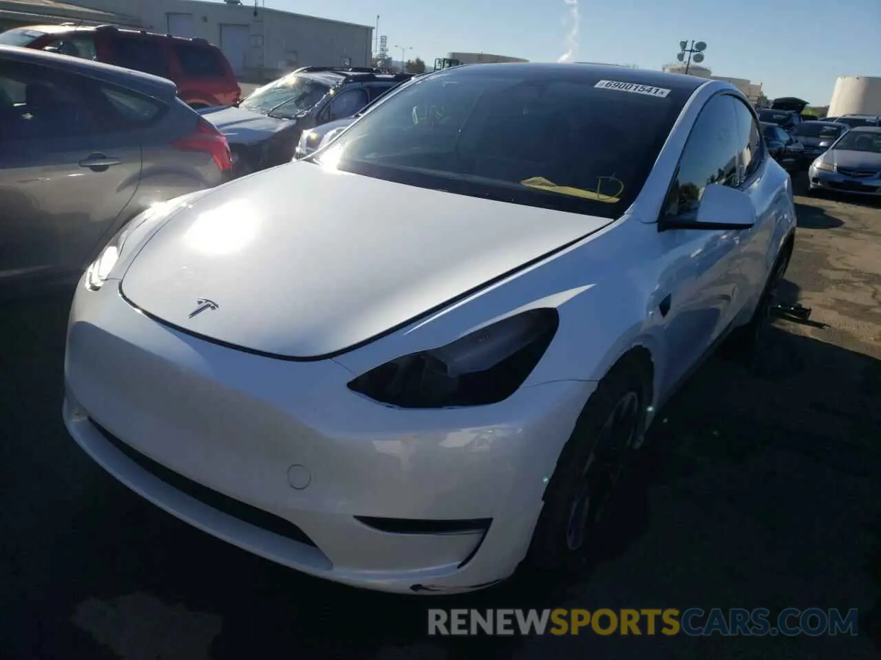 2 fotografías del automóvil dañado 5YJYGDEE7MF217529 TESLA MODEL Y 2021