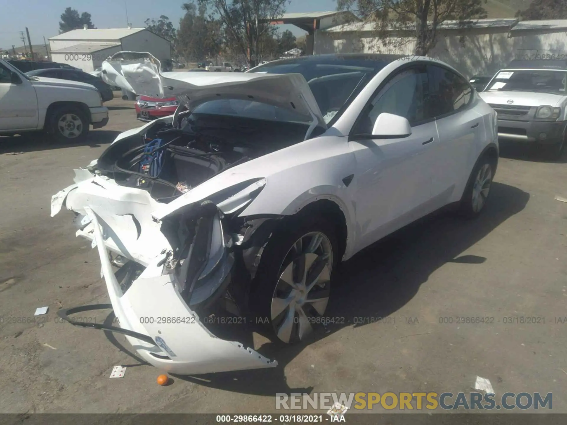 2 fotografías del automóvil dañado 5YJYGDEE8MF063414 TESLA MODEL Y 2021