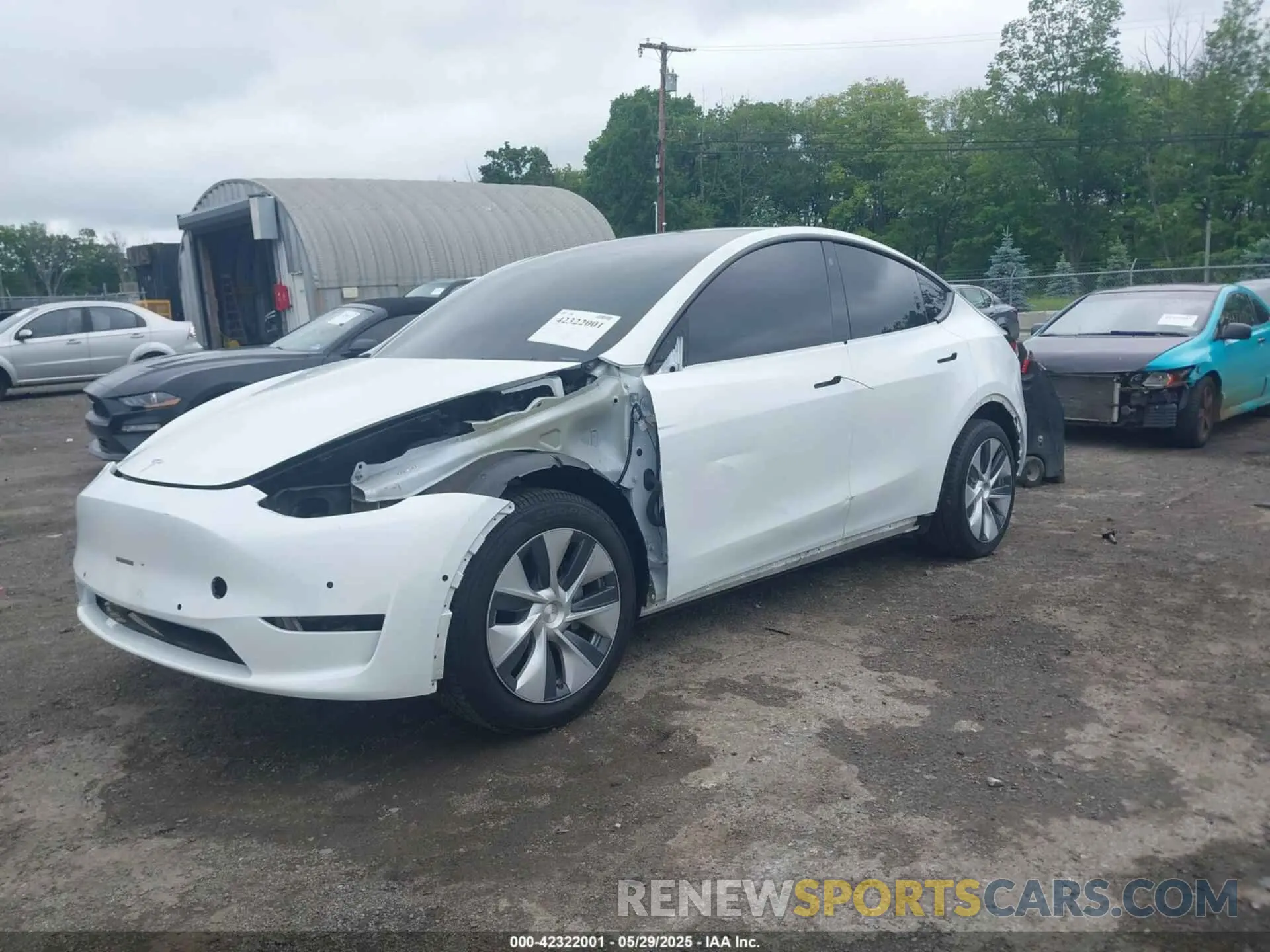 2 fotografías del automóvil dañado 5YJYGDEE8MF085574 TESLA MODEL Y 2021
