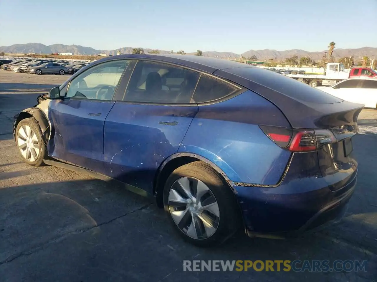 2 fotografías del automóvil dañado 5YJYGDEE8MF148849 TESLA MODEL Y 2021