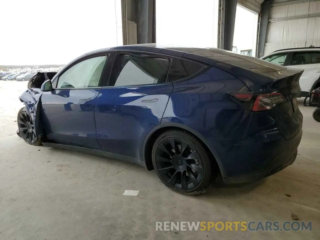 2 fotografías del automóvil dañado 5YJYGDEE8MF208063 TESLA MODEL Y 2021
