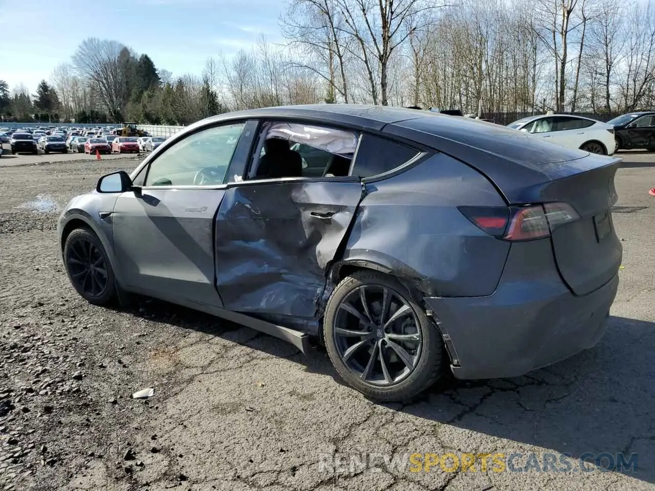 2 fotografías del automóvil dañado 5YJYGDEE8MF217460 TESLA MODEL Y 2021