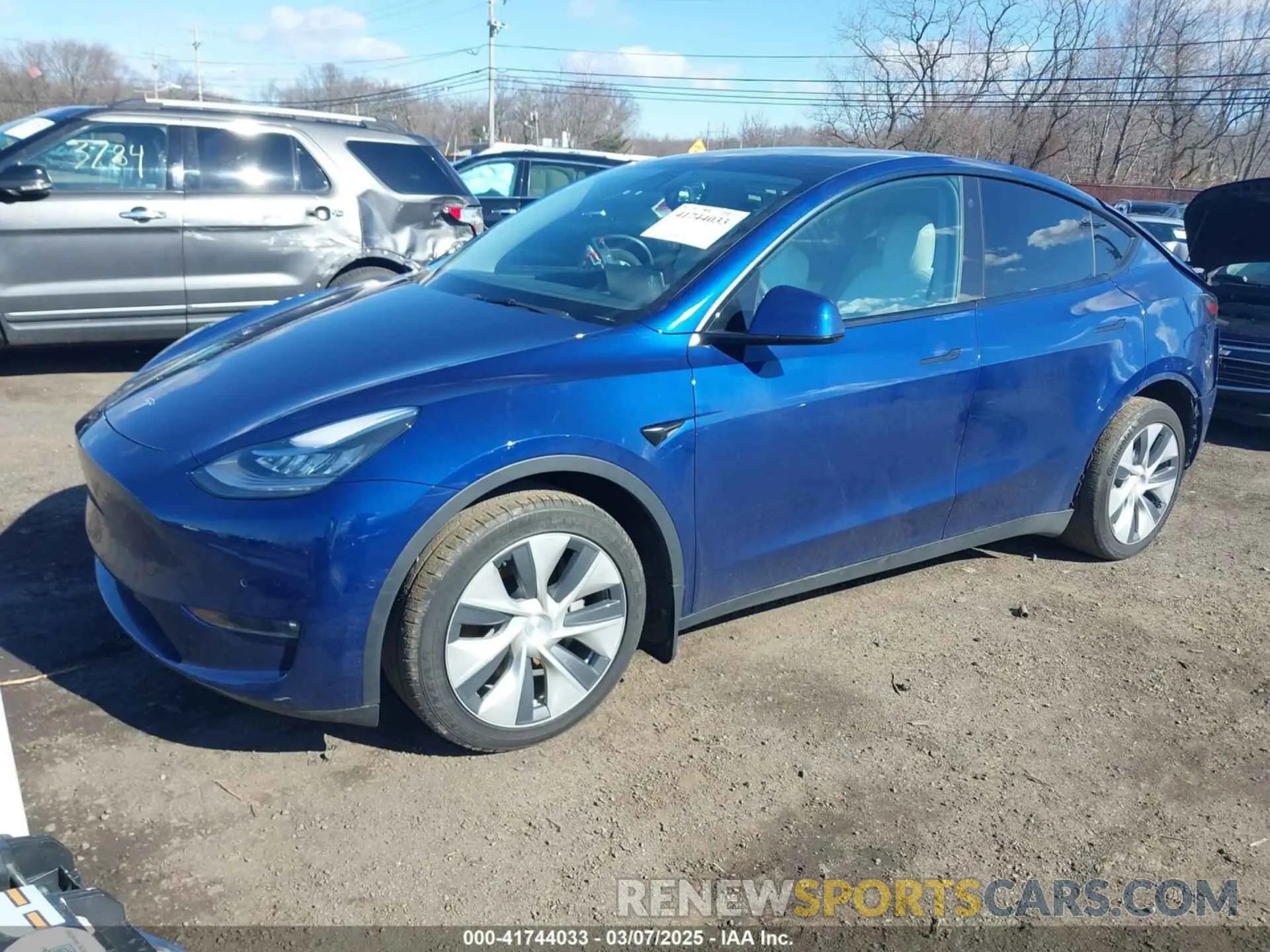 2 fotografías del automóvil dañado 5YJYGDEE8MF293230 TESLA MODEL Y 2021