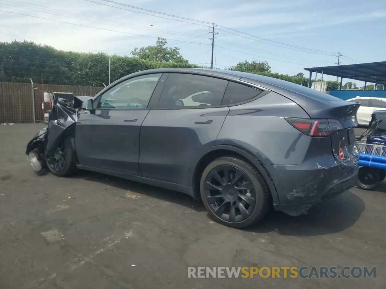 2 fotografías del automóvil dañado 5YJYGDEE9MF243226 TESLA MODEL Y 2021