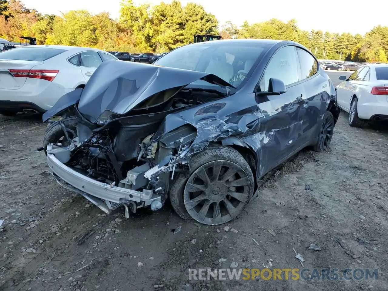 2 fotografías del automóvil dañado 5YJYGDEEXMF063270 TESLA MODEL Y 2021