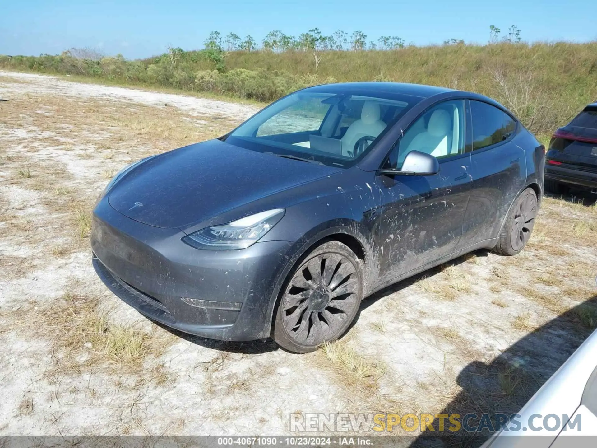 2 fotografías del automóvil dañado 5YJYGDEF0MF090096 TESLA MODEL Y 2021