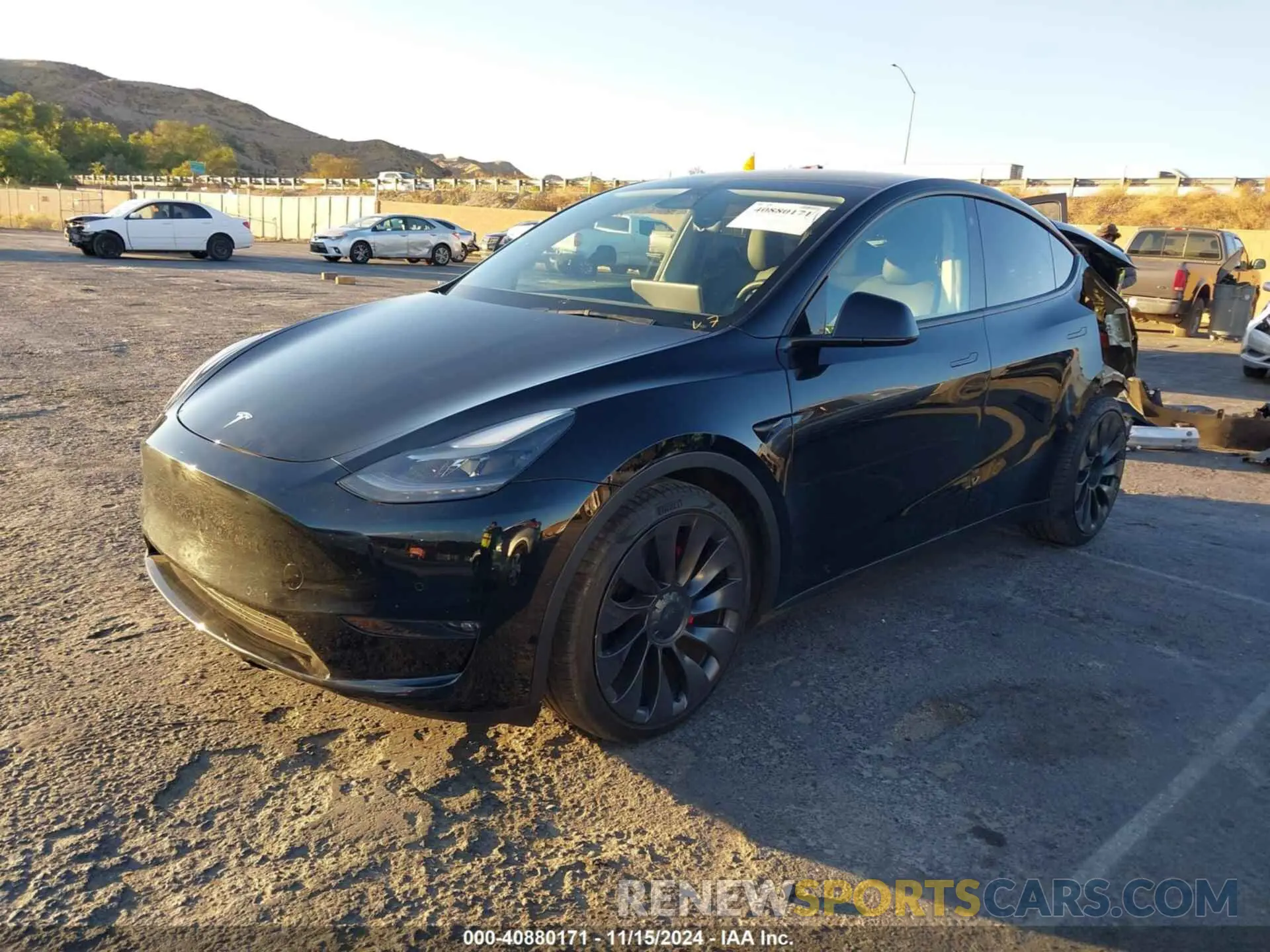 2 fotografías del automóvil dañado 5YJYGDEF6MF306484 TESLA MODEL Y 2021