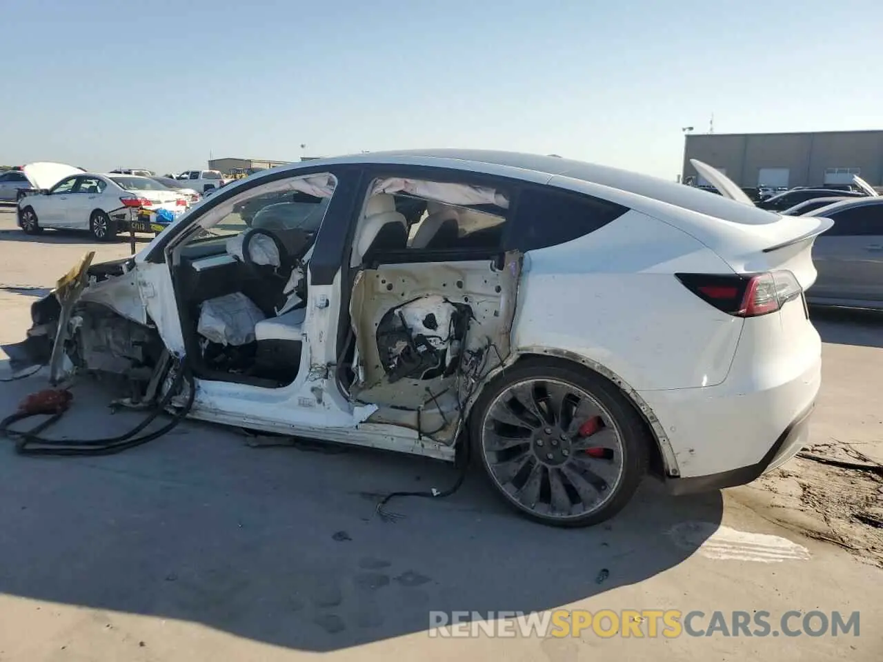 2 fotografías del automóvil dañado 5YJYGDEF9MF211692 TESLA MODEL Y 2021