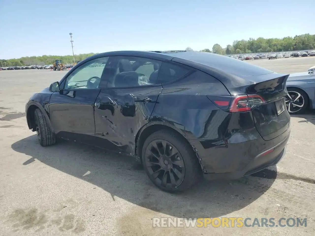 2 fotografías del automóvil dañado 7SAYGAEE1PF709673 TESLA MODEL Y 2023