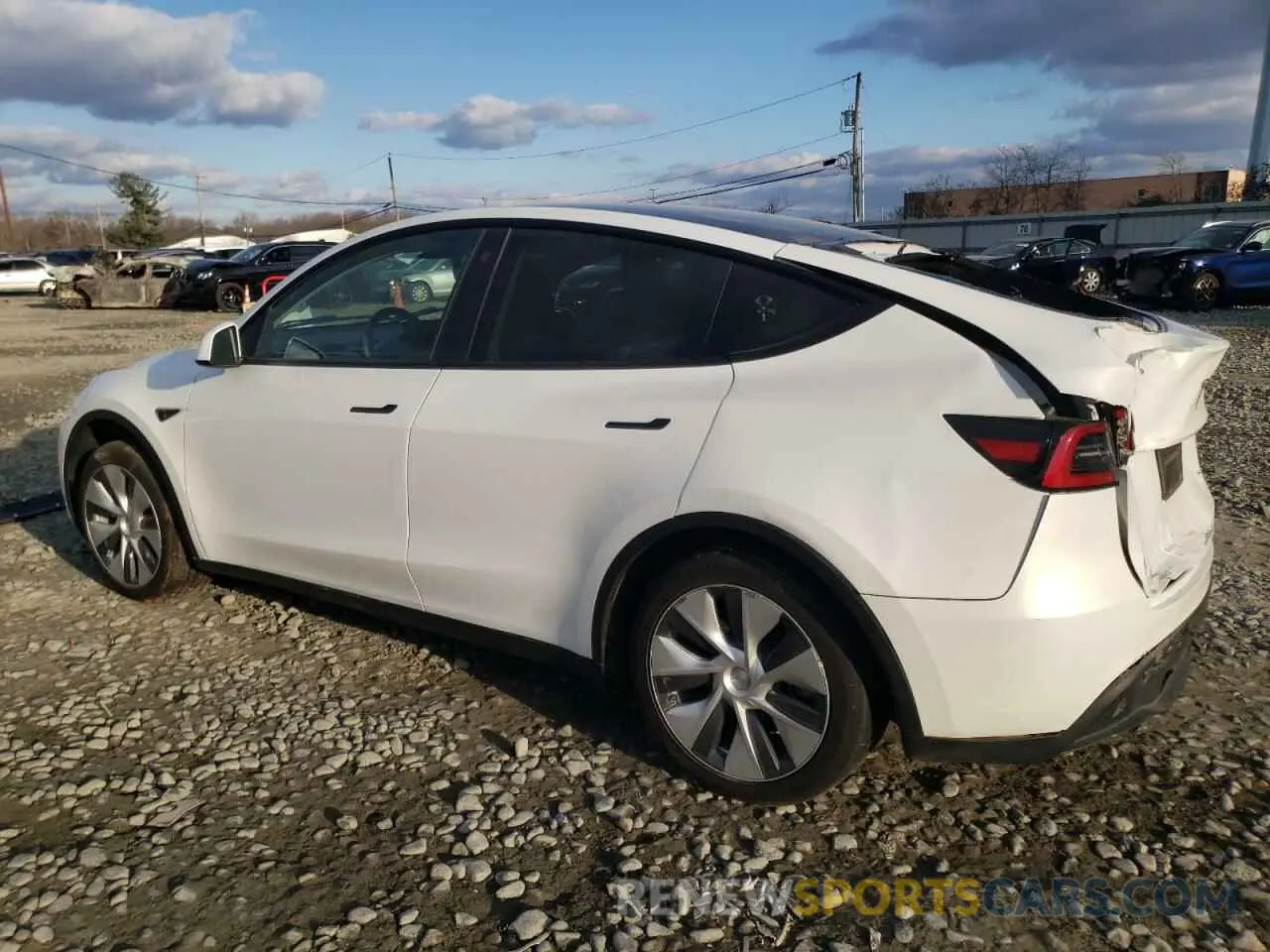 2 fotografías del automóvil dañado 7SAYGAEE7PF749059 TESLA MODEL Y 2023