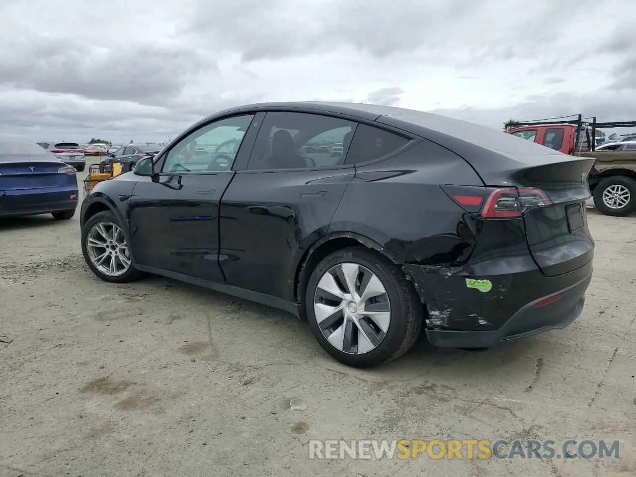 2 fotografías del automóvil dañado 7SAYGAEE9PF716323 TESLA MODEL Y 2023