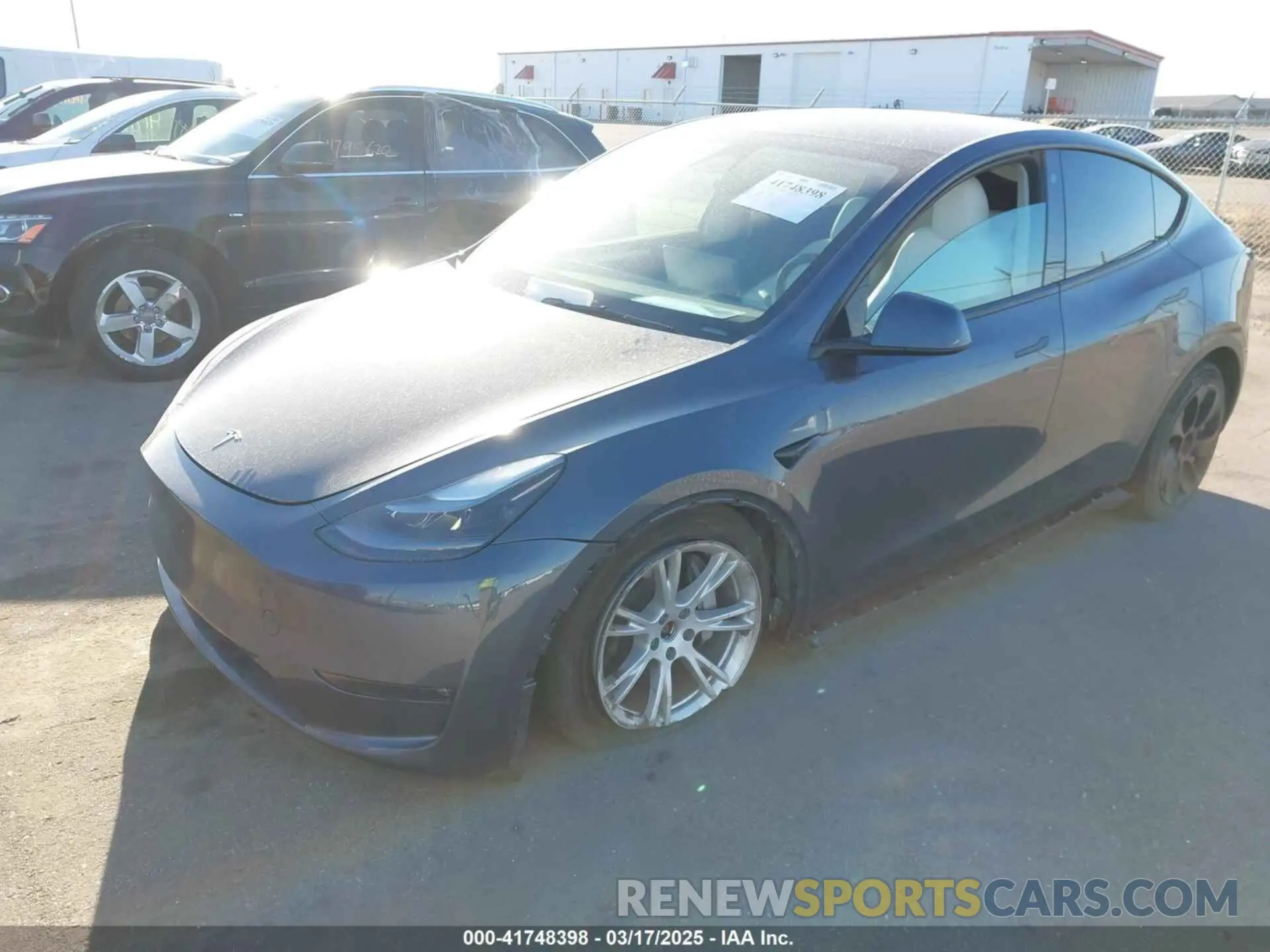 2 fotografías del automóvil dañado 7SAYGAEEXPF714760 TESLA MODEL Y 2023