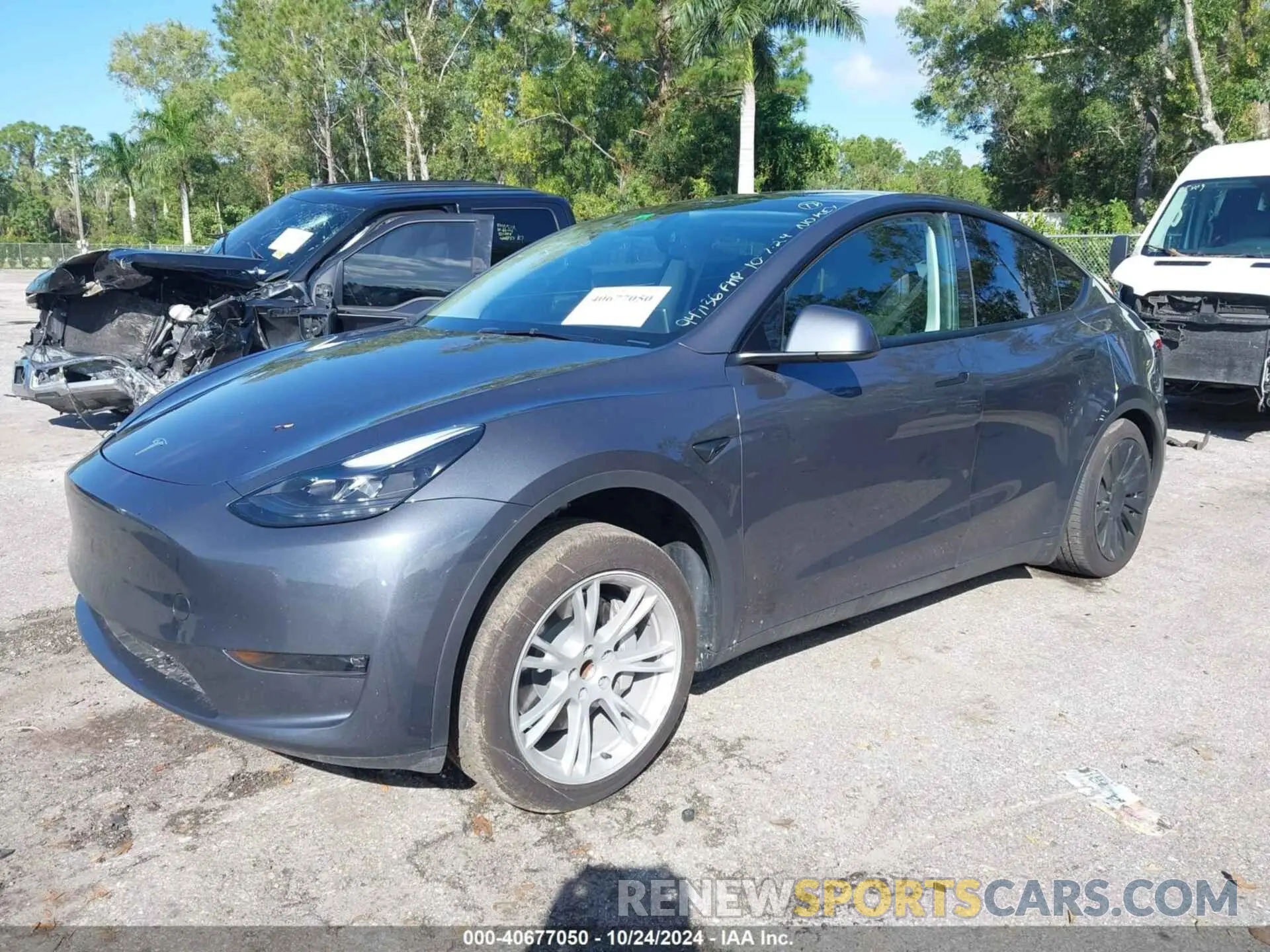 2 fotografías del automóvil dañado 7SAYGDED2PF947136 TESLA MODEL Y 2023