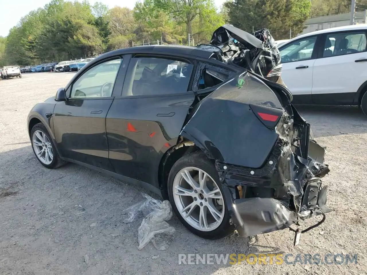 2 fotografías del automóvil dañado 7SAYGDED4PF931181 TESLA MODEL Y 2023