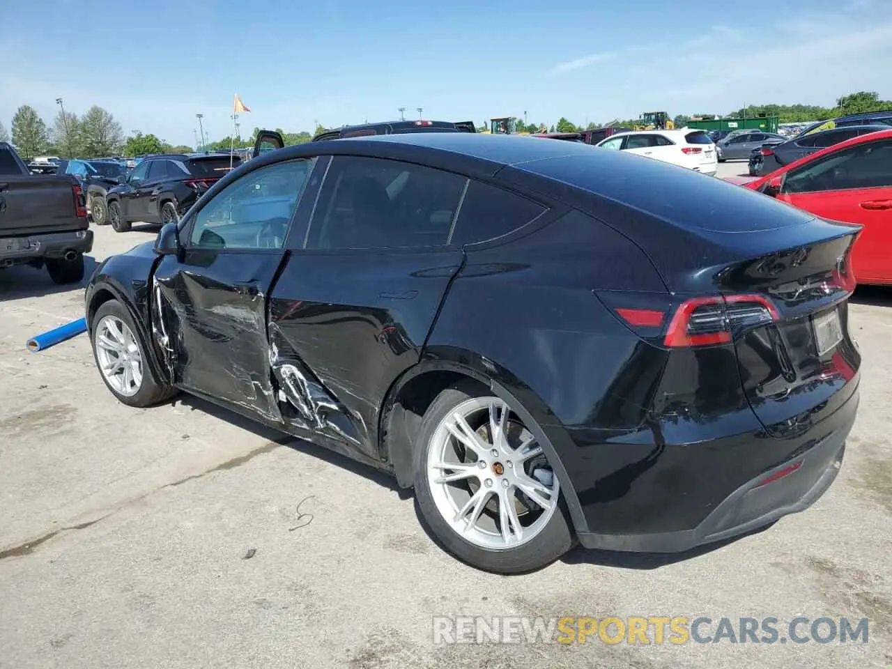 2 fotografías del automóvil dañado 7SAYGDED4PF966366 TESLA MODEL Y 2023