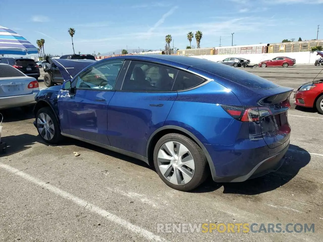 2 fotografías del automóvil dañado 7SAYGDED5PF965159 TESLA MODEL Y 2023
