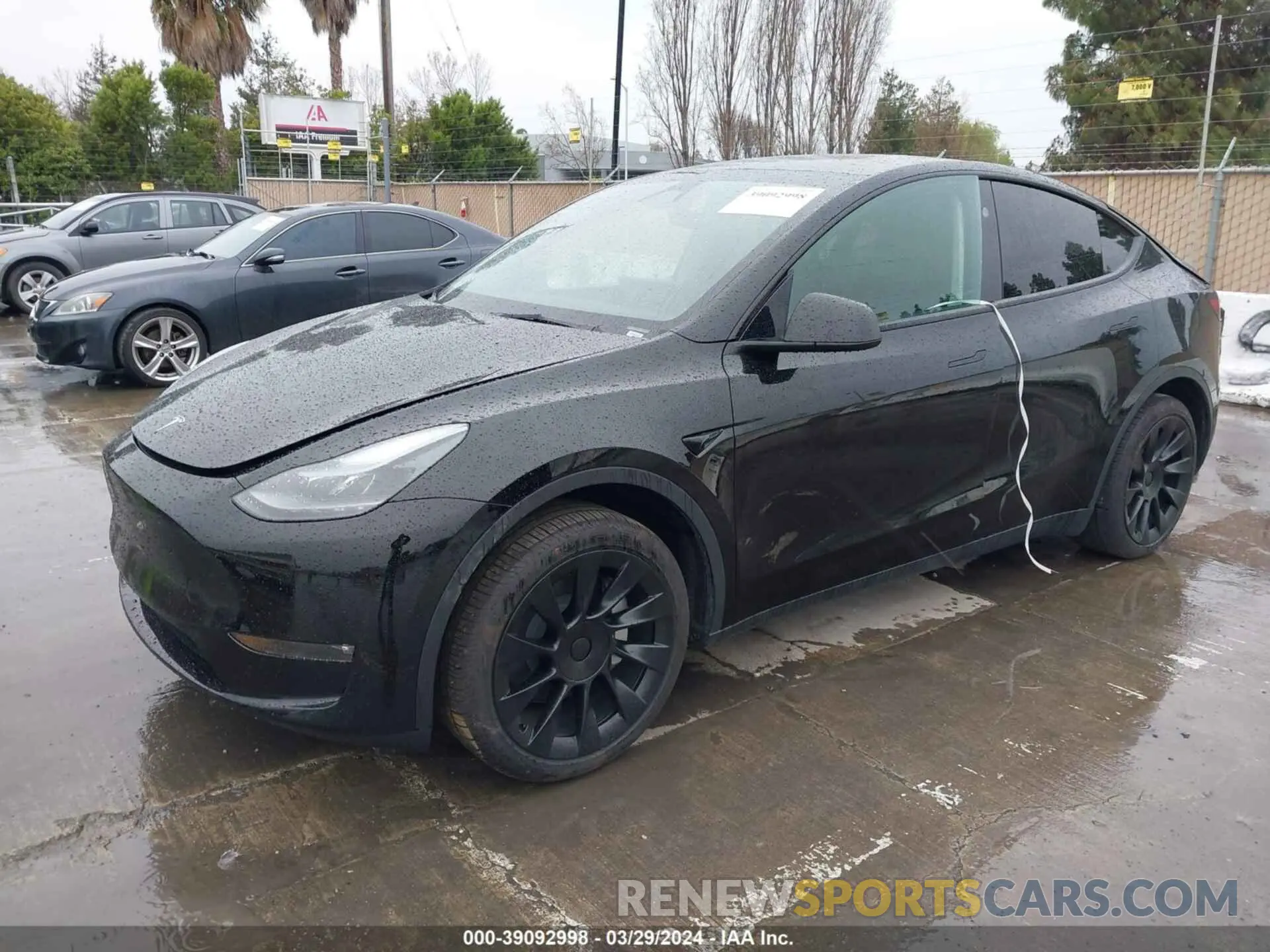 2 fotografías del automóvil dañado 7SAYGDED8PF976883 TESLA MODEL Y 2023