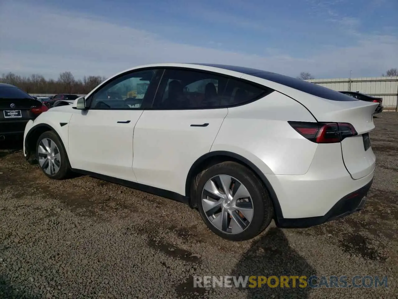2 fotografías del automóvil dañado 7SAYGDEE0PA065923 TESLA MODEL Y 2023