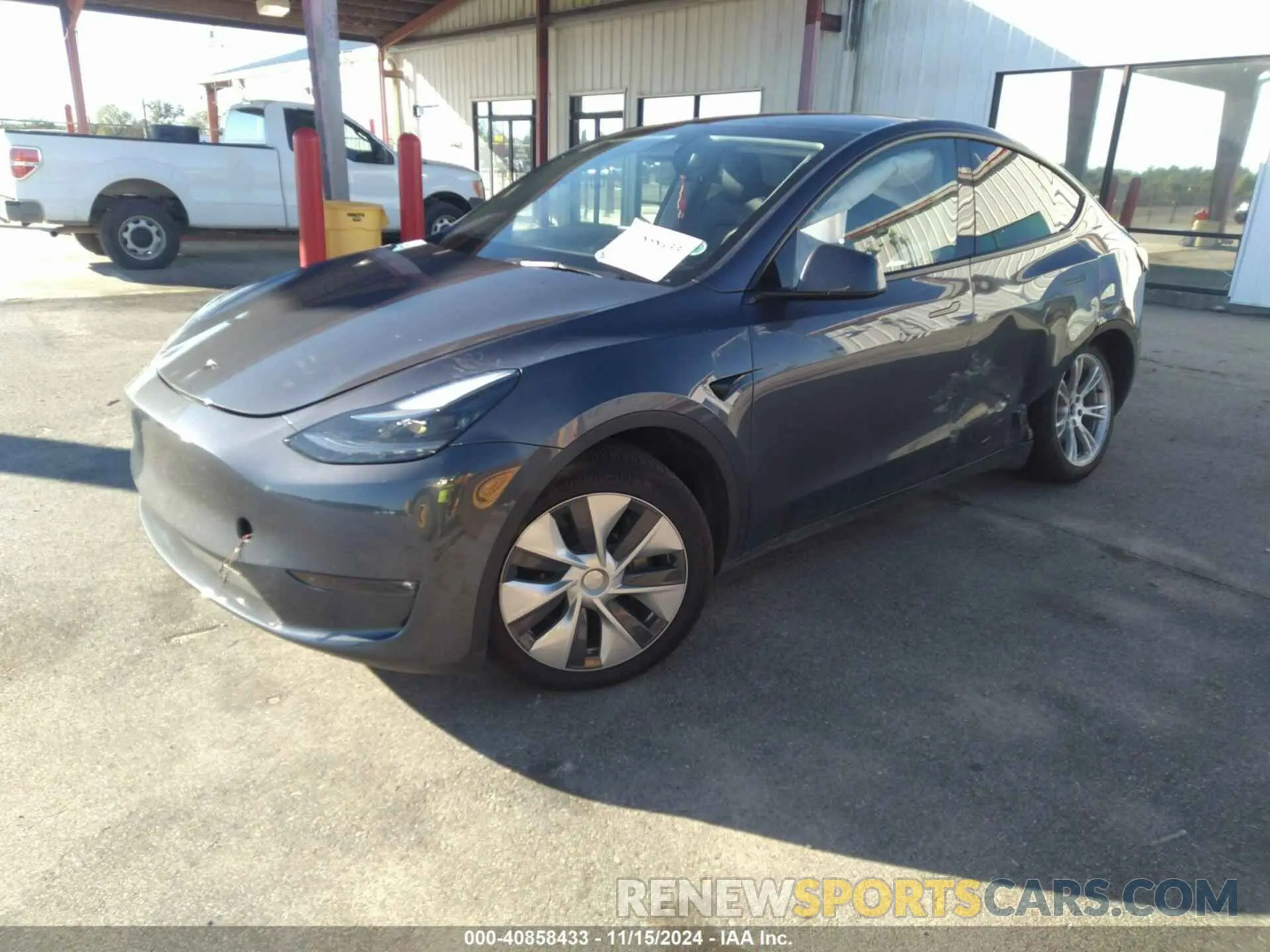 2 fotografías del automóvil dañado 7SAYGDEE1PF921037 TESLA MODEL Y 2023