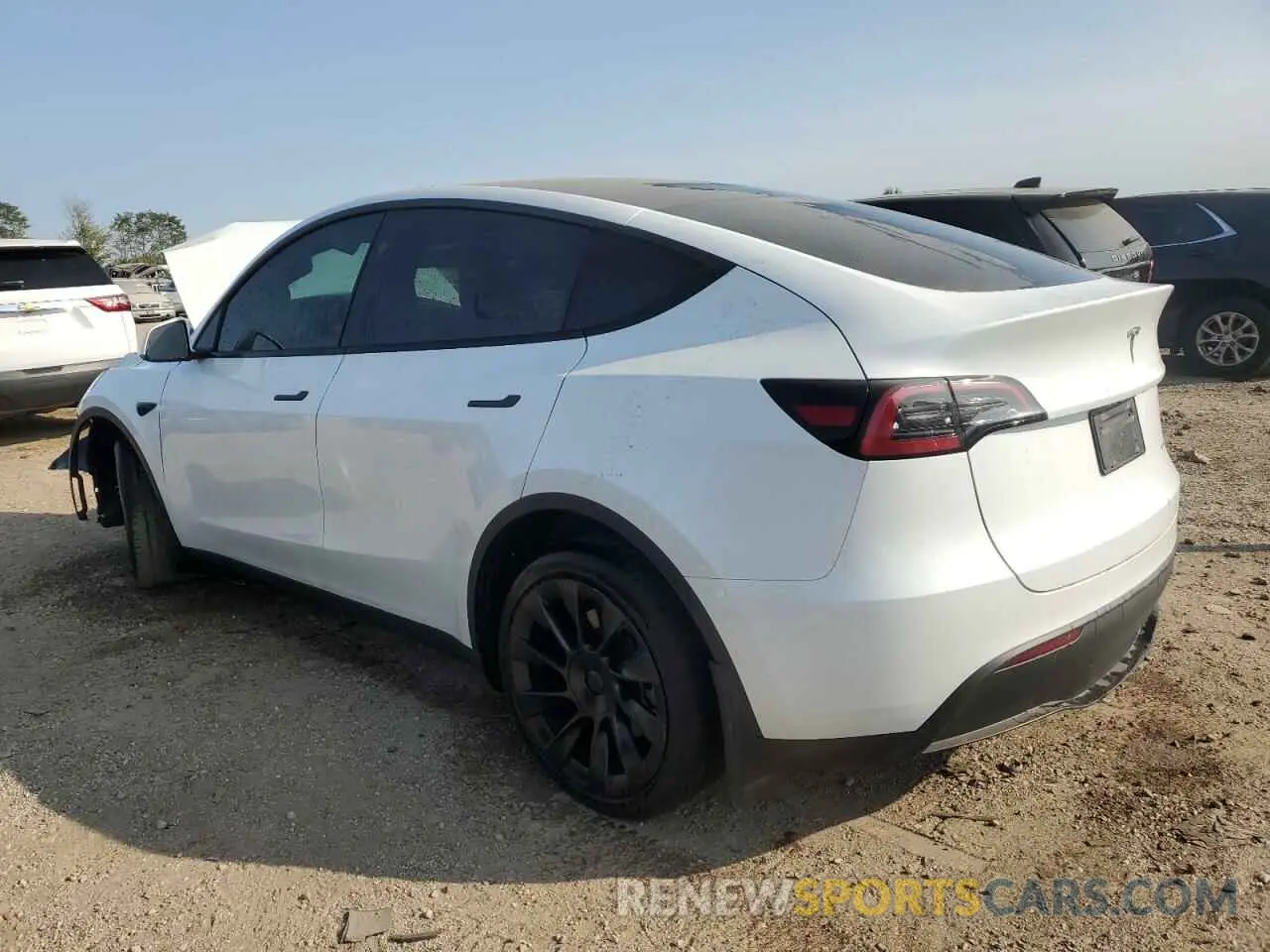 2 fotografías del automóvil dañado 7SAYGDEE2PA165795 TESLA MODEL Y 2023