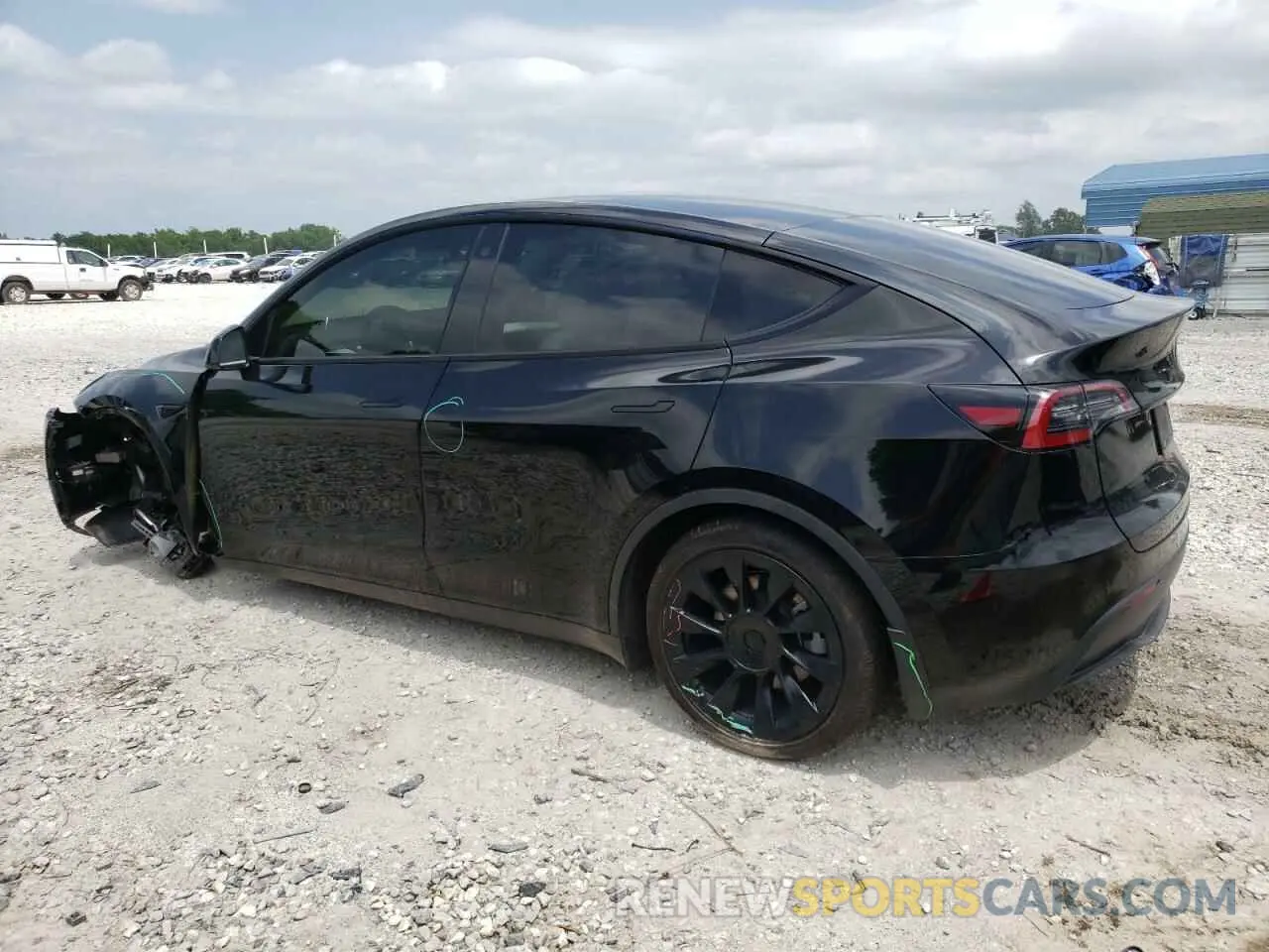 2 fotografías del automóvil dañado 7SAYGDEE2PF750444 TESLA MODEL Y 2023