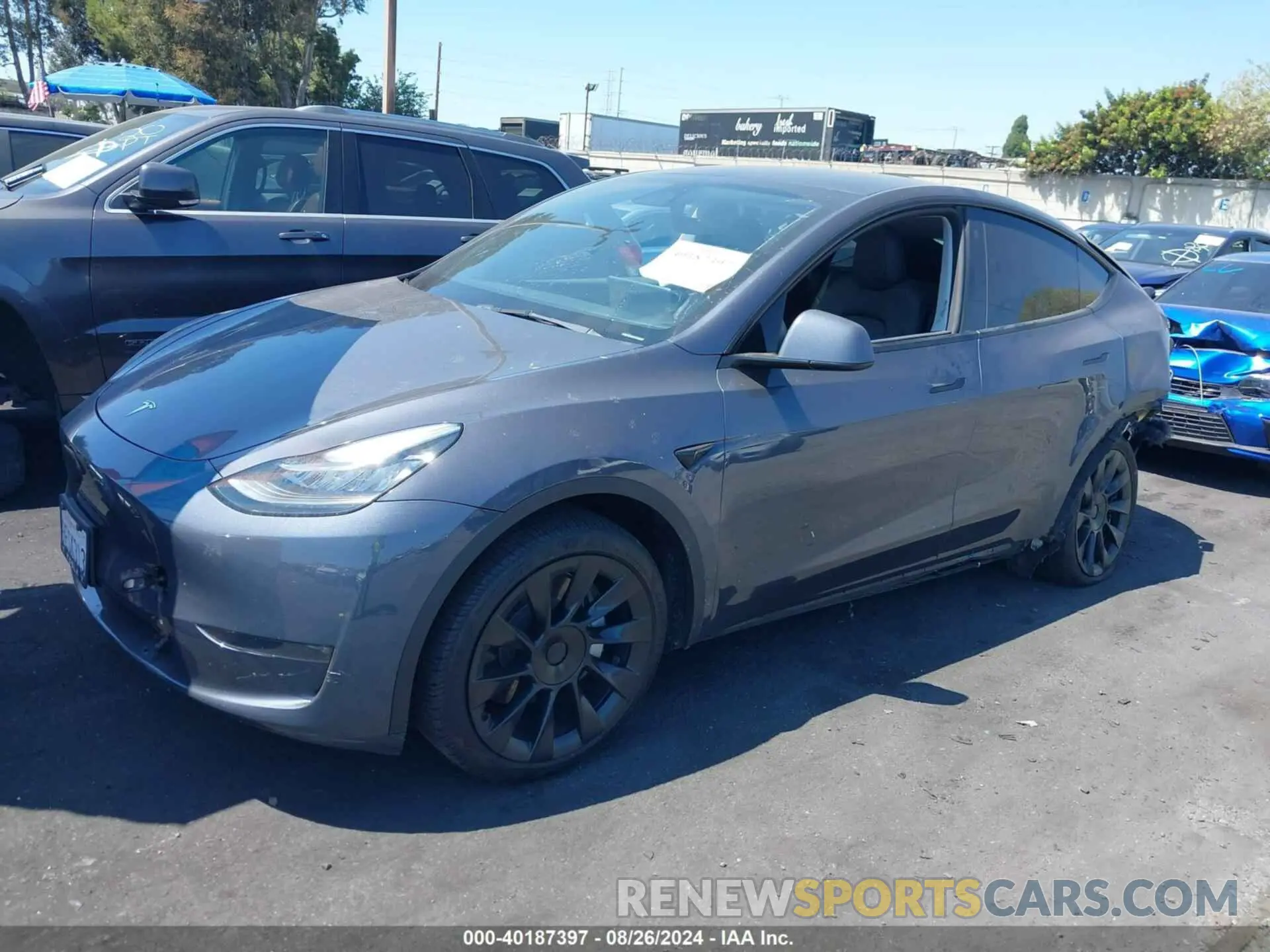 2 fotografías del automóvil dañado 7SAYGDEE9PA047291 TESLA MODEL Y 2023