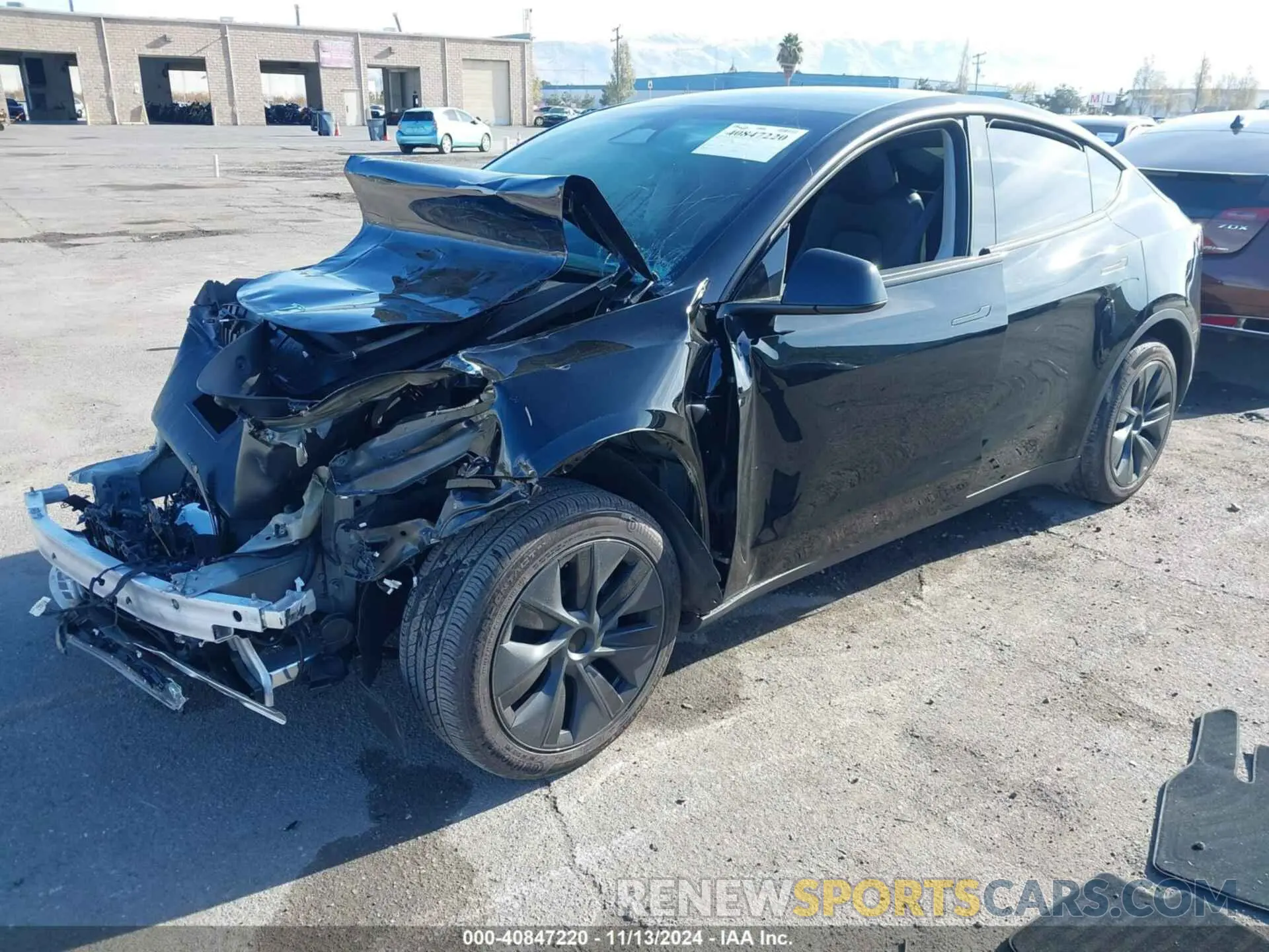 2 fotografías del automóvil dañado 7SAYGAEE4RF126078 TESLA MODEL Y 2024